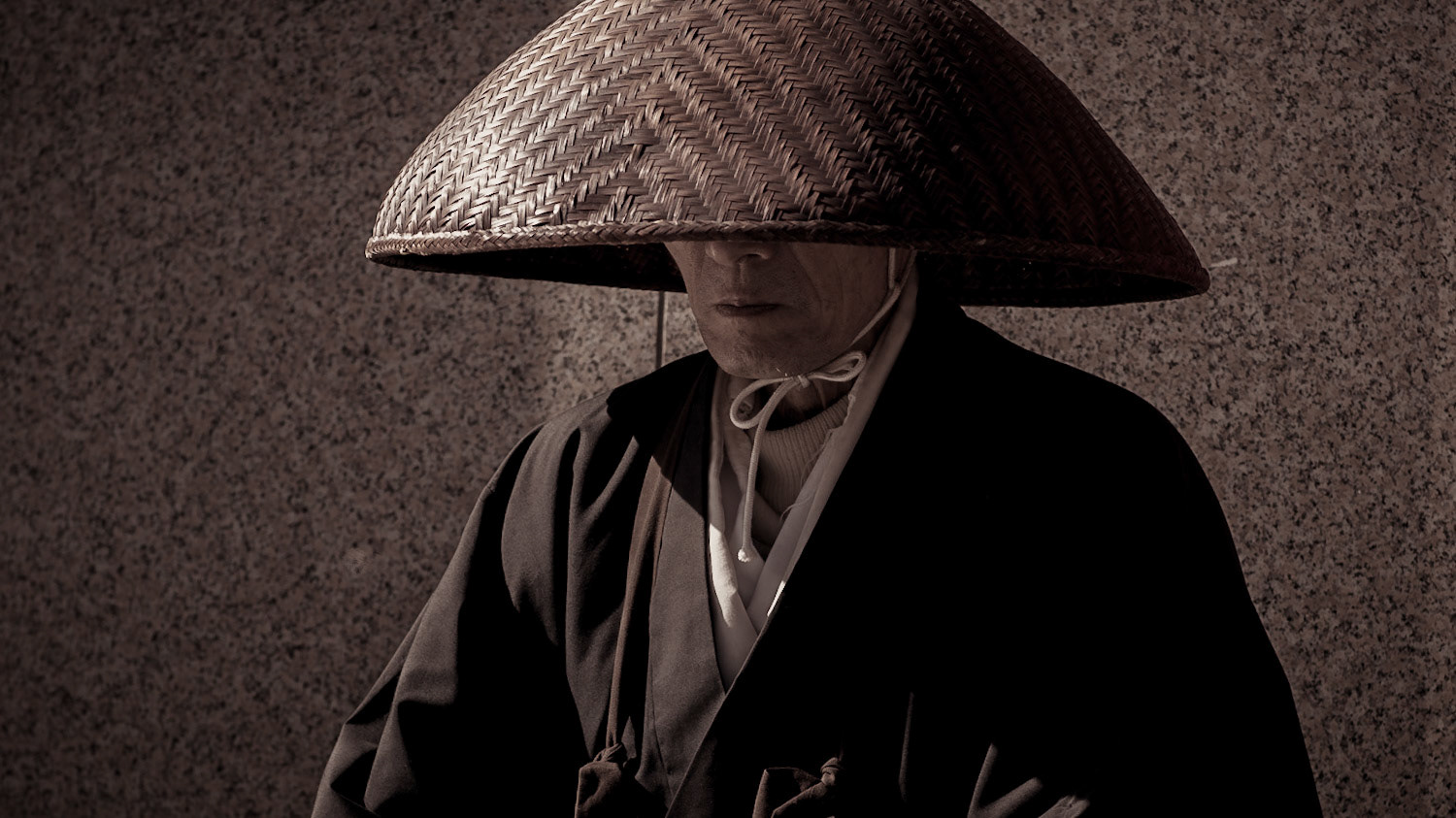A buddhist monks collecting alms on the street. Himeji, Japan