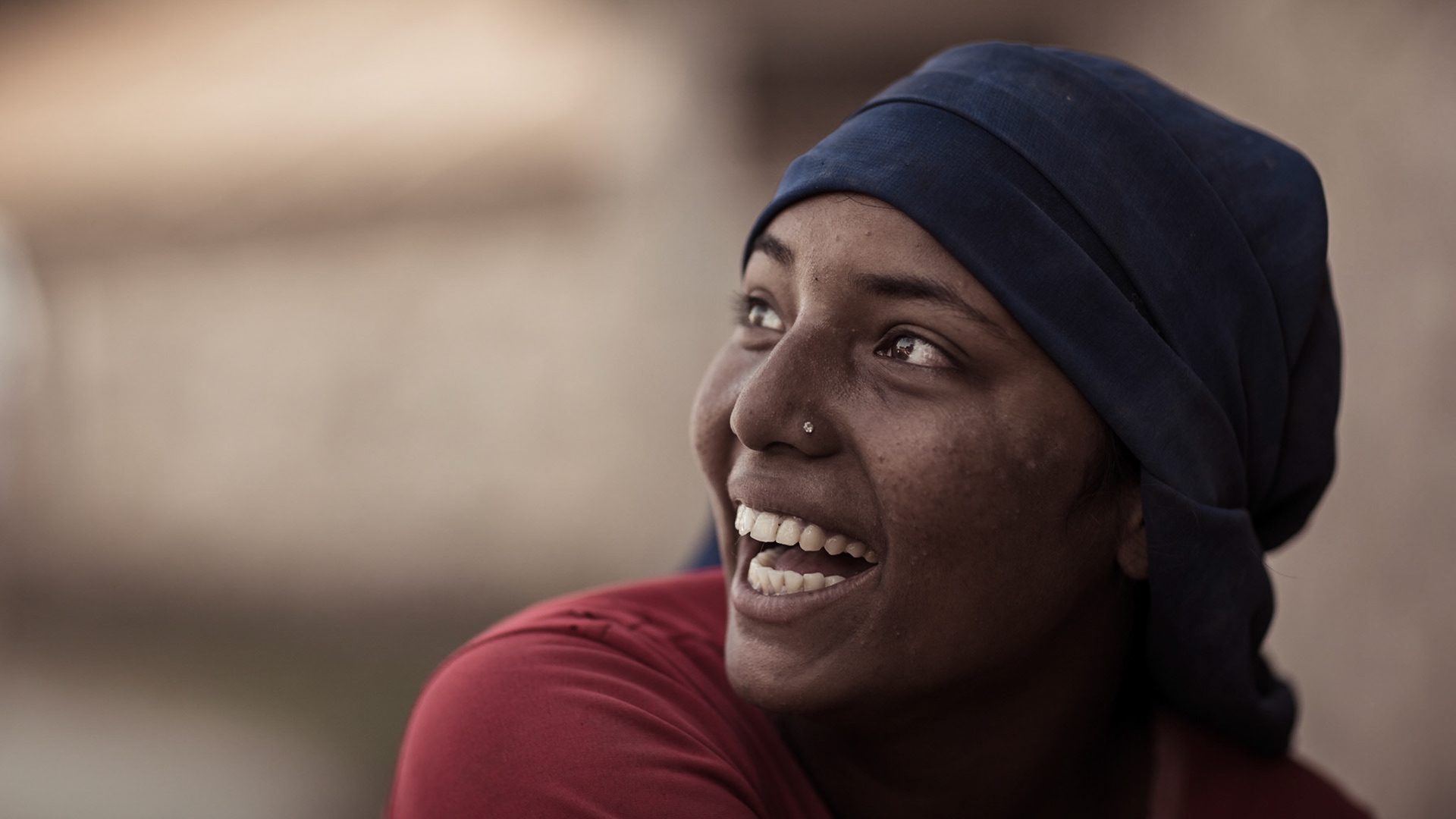 A young woman doing heavy work in the construction of house. Pokhara, Nepal