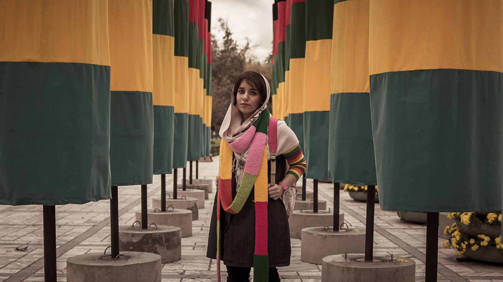 Unexpected background matches wonderfuly to this young girls colorful expression. Tehran, Iran