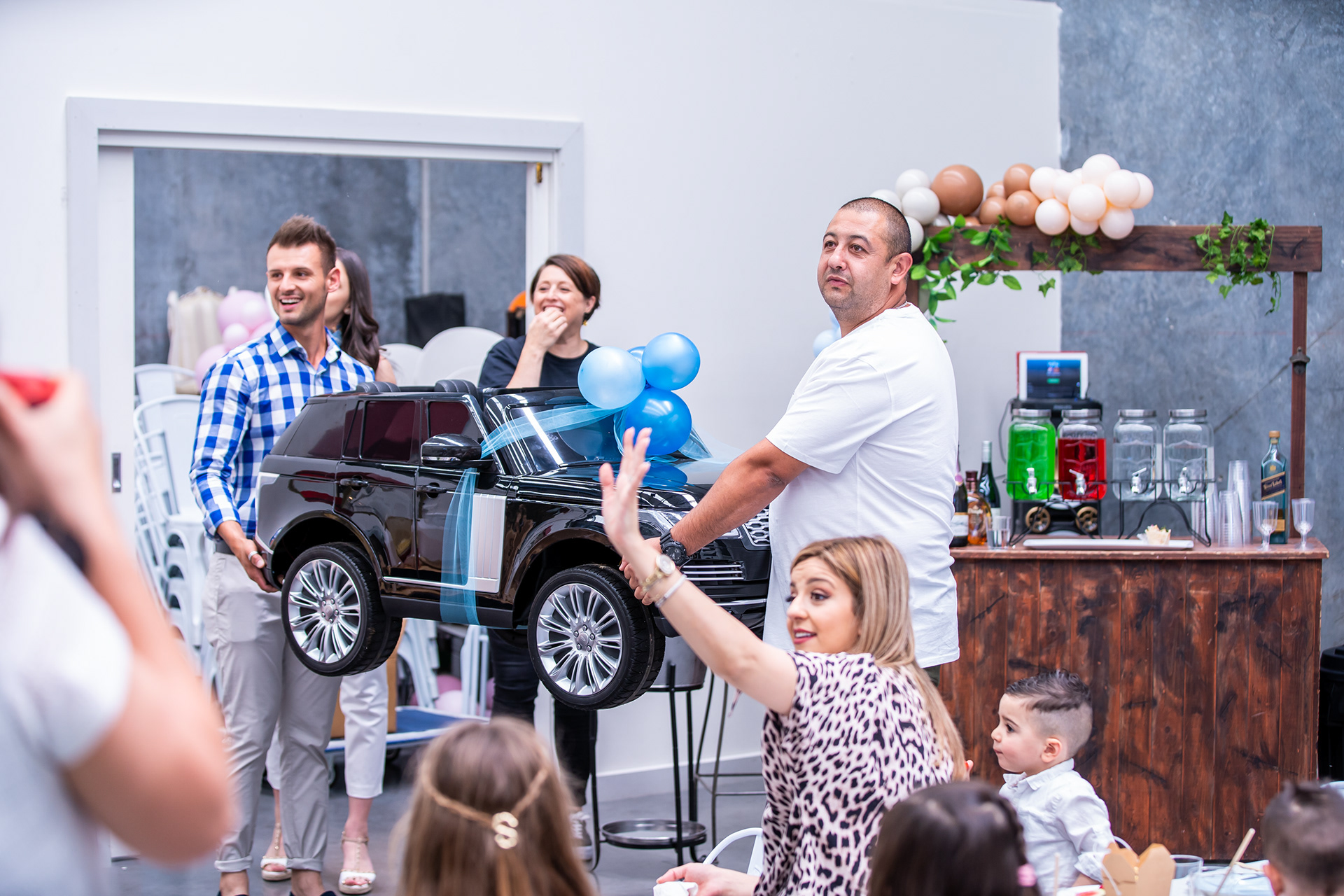 Guests watching a performer during a family celebration