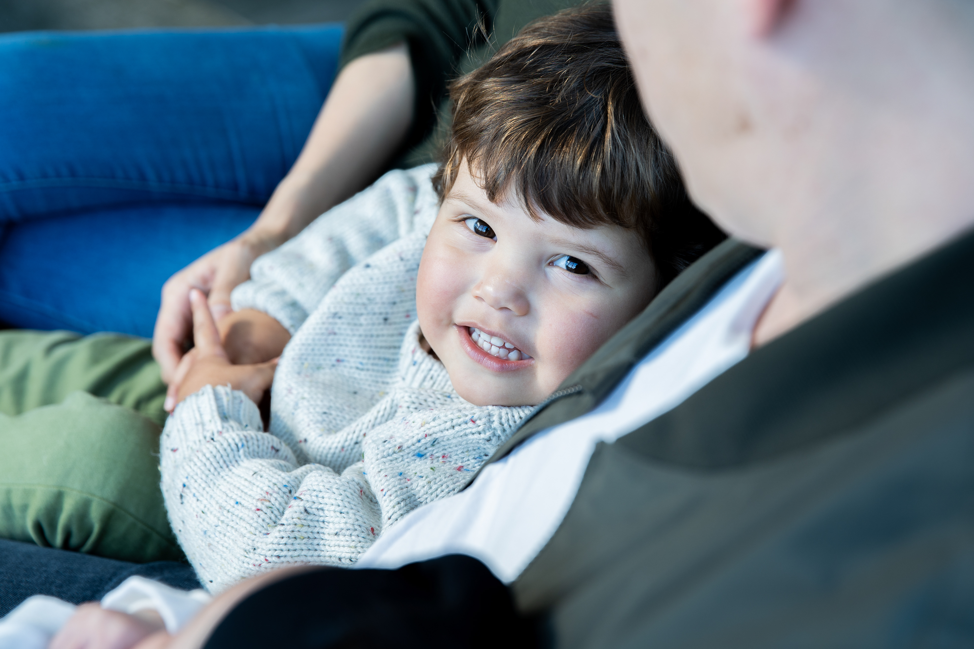 Child resting on a sofa at home