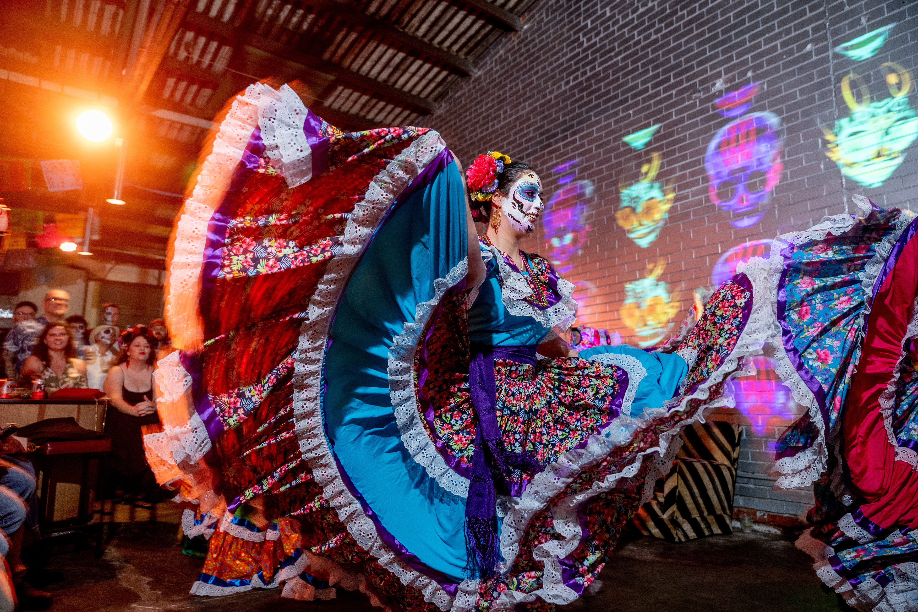 Dancers in colourful costumes on a stage