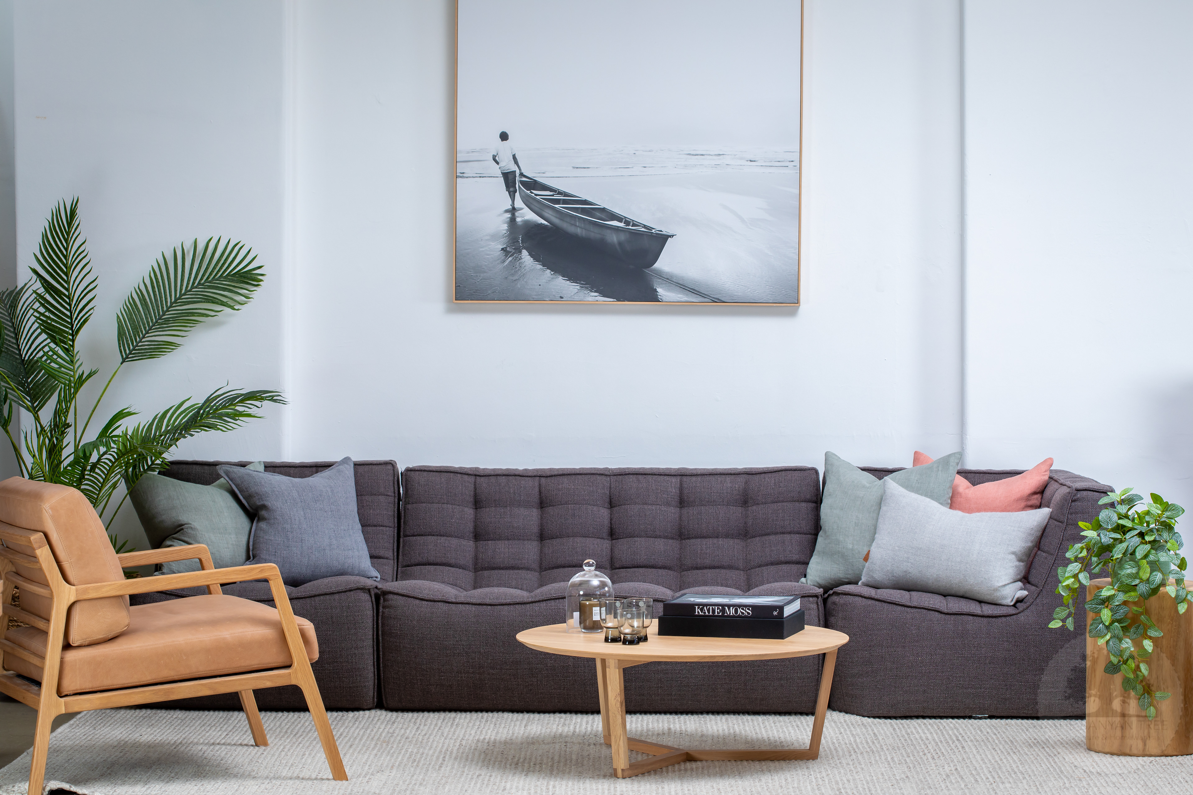 Styled living room with a grey sofa, armchair and coffee table