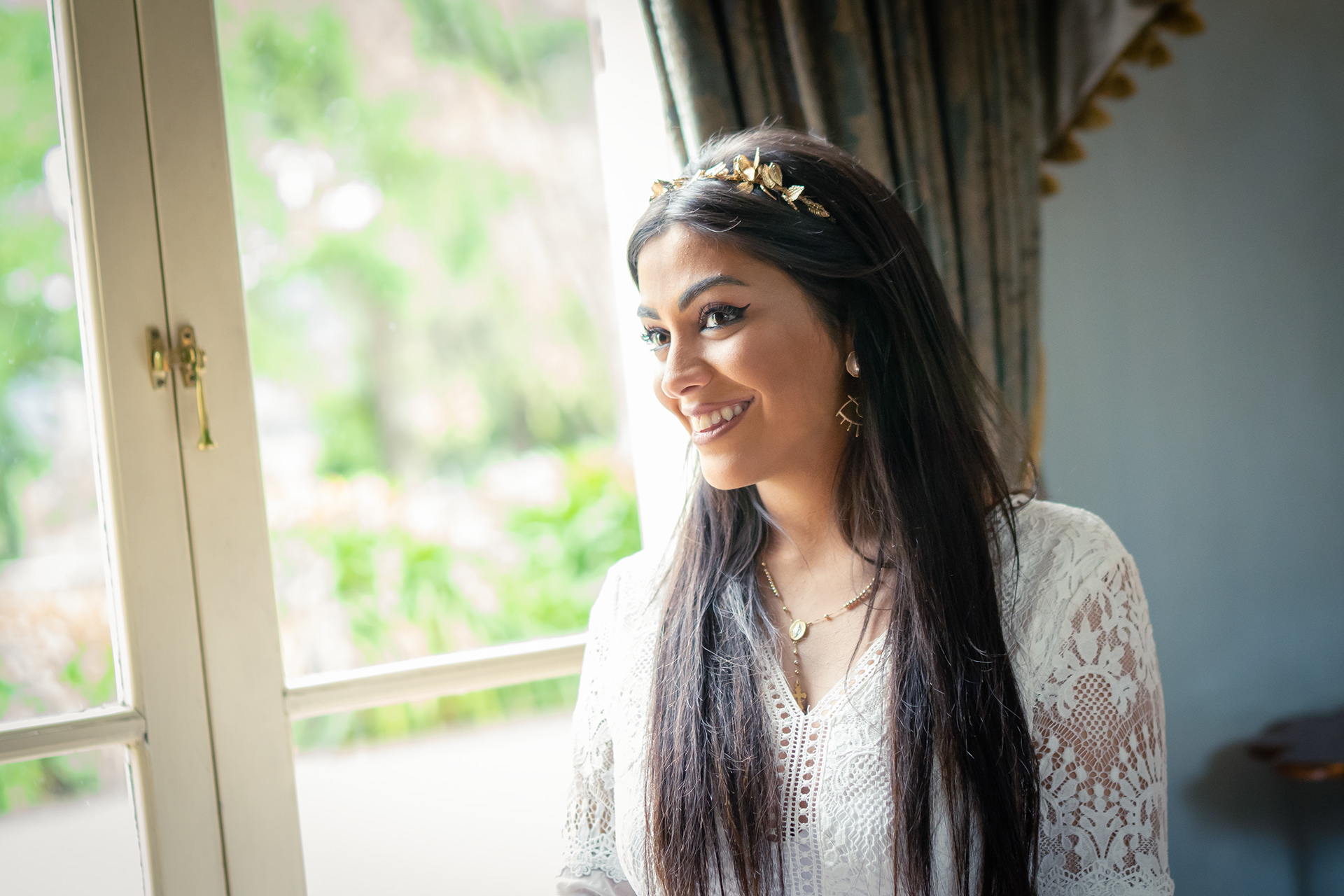 Portrait of a guest beside a bright window