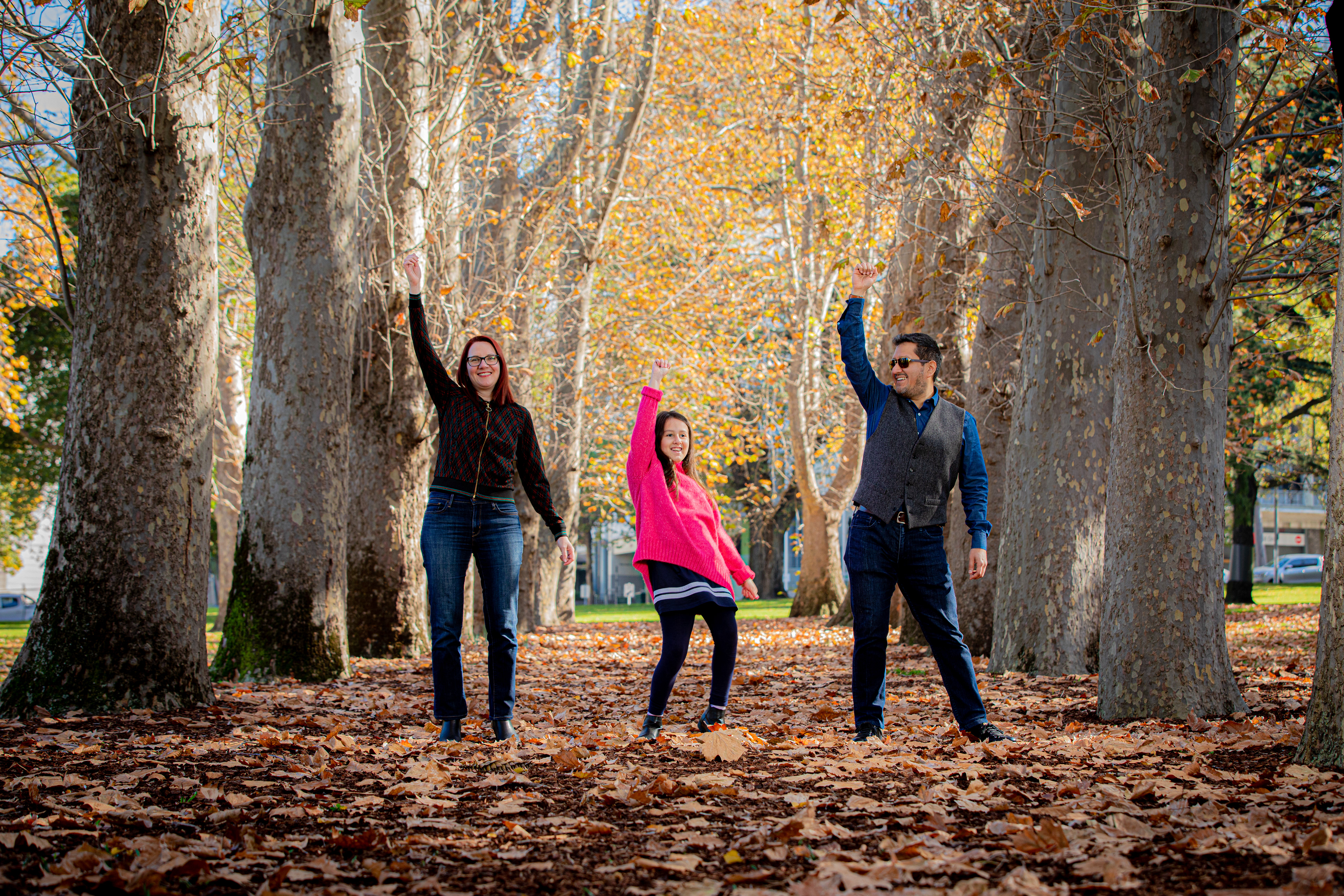 Family walking through an autumn park