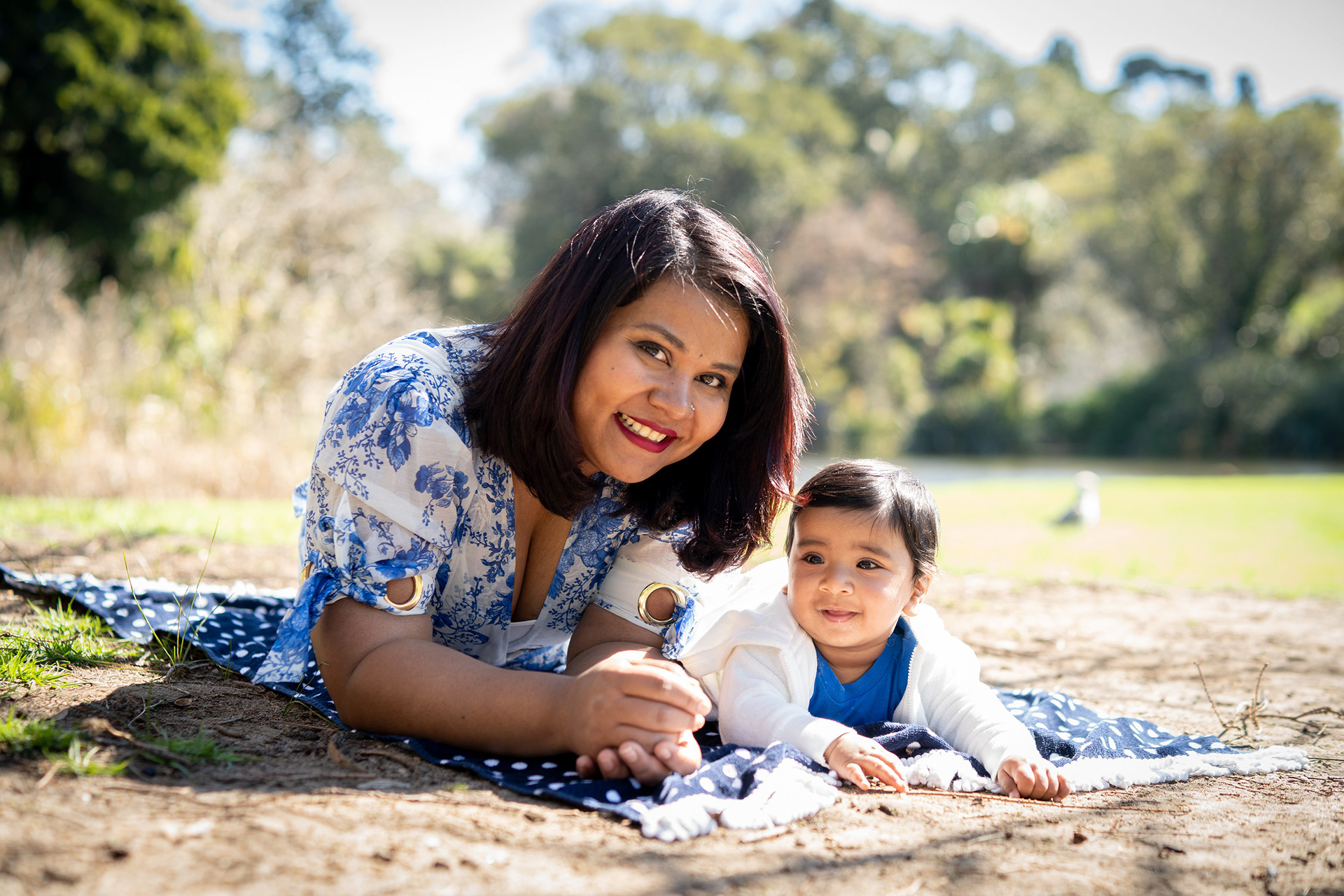 Maternity portrait reclining on a picnic blanket