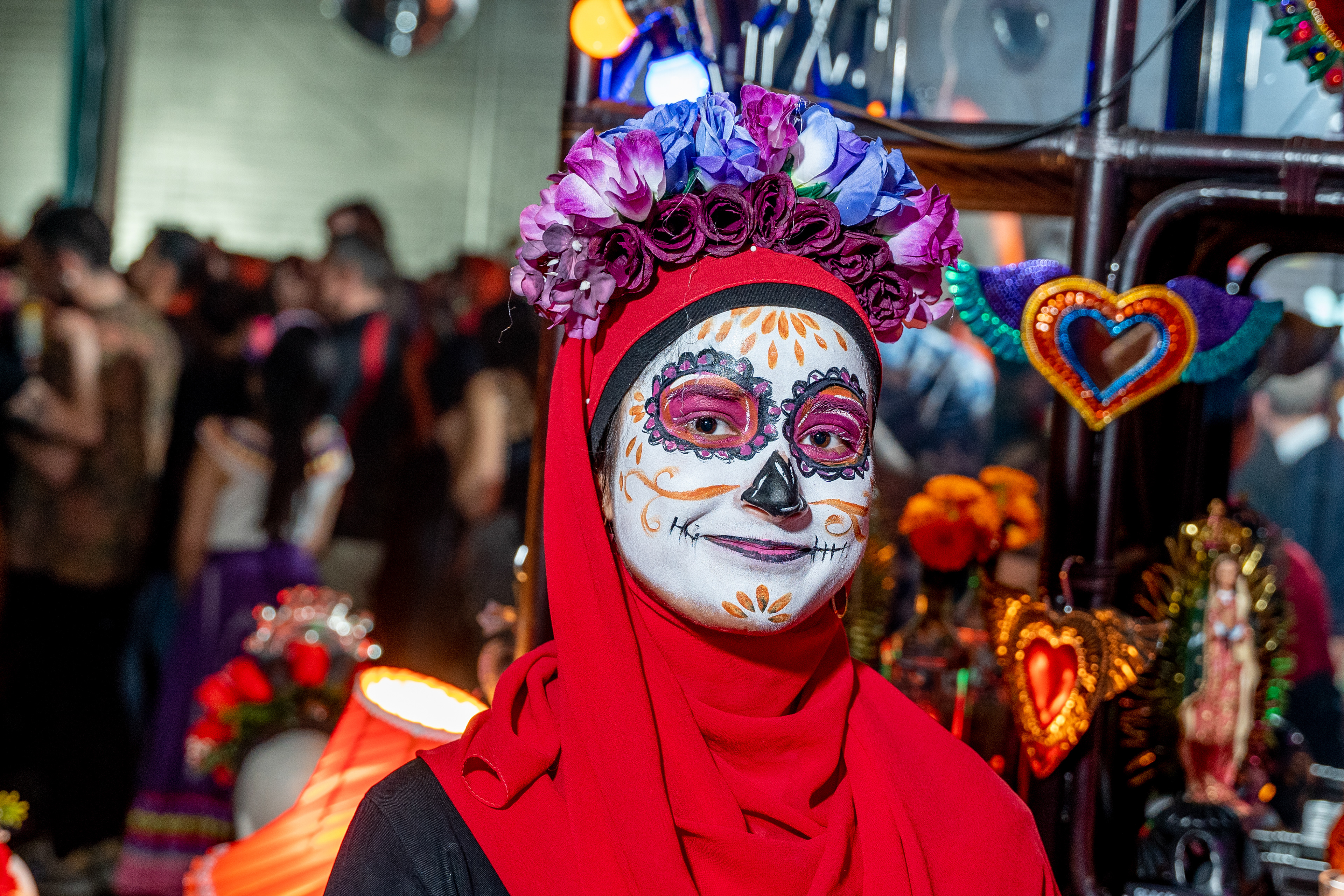 Close-up of elaborate skull makeup and a decorated hat