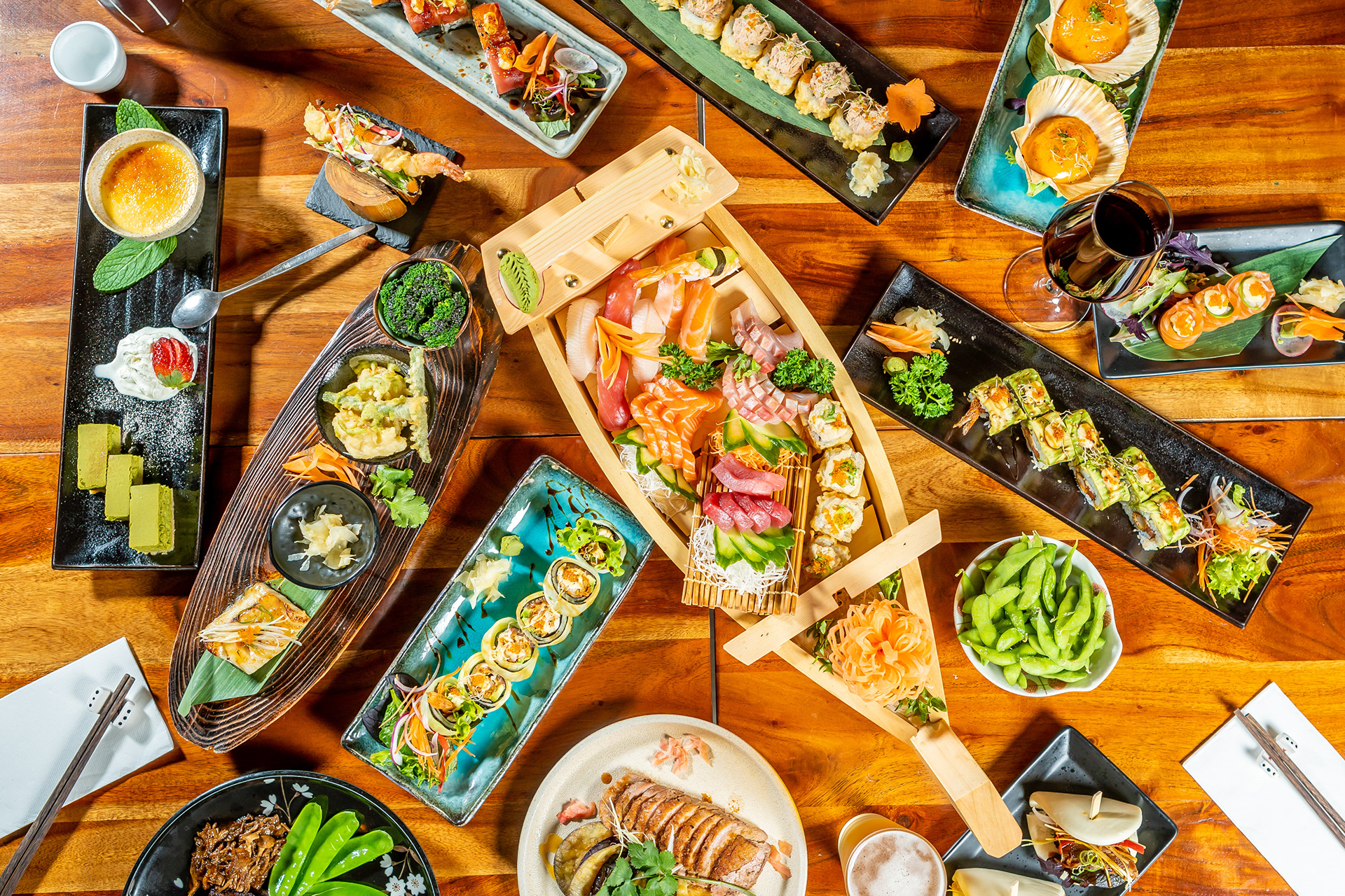 Overhead view of Asian dishes on a green restaurant table