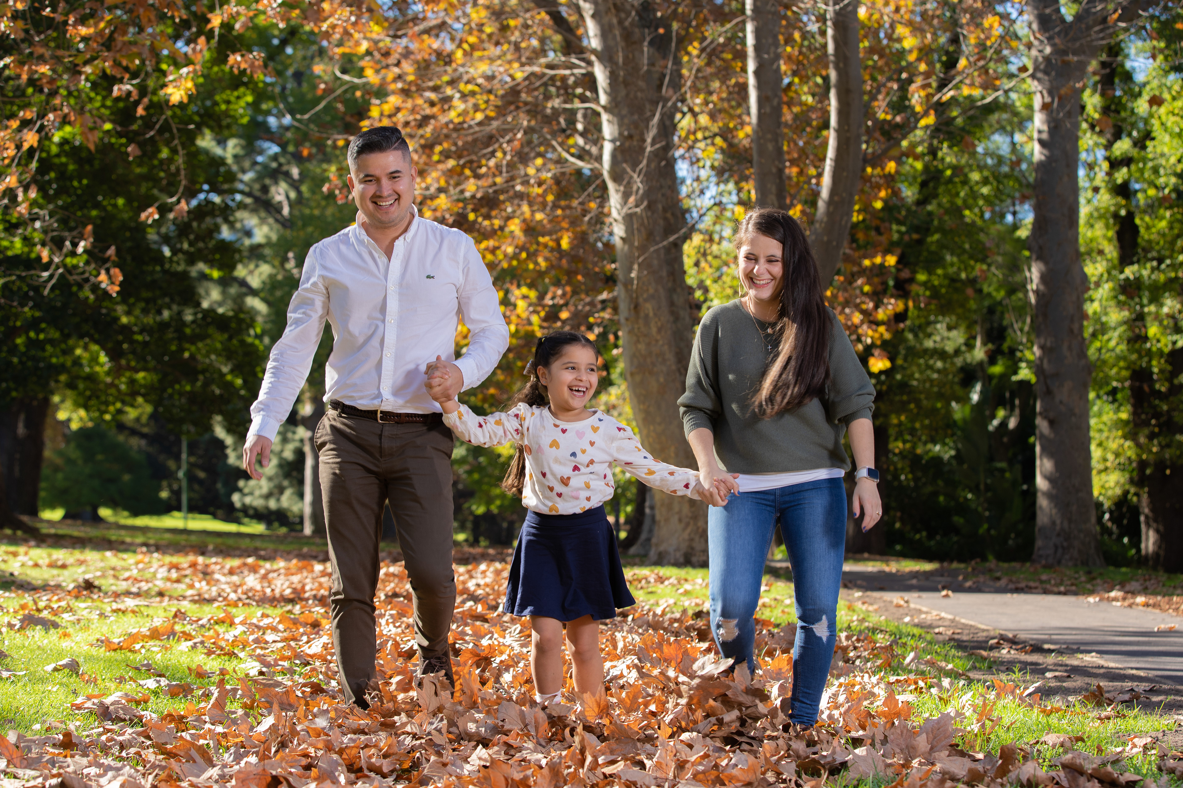 Family walking together along a park path