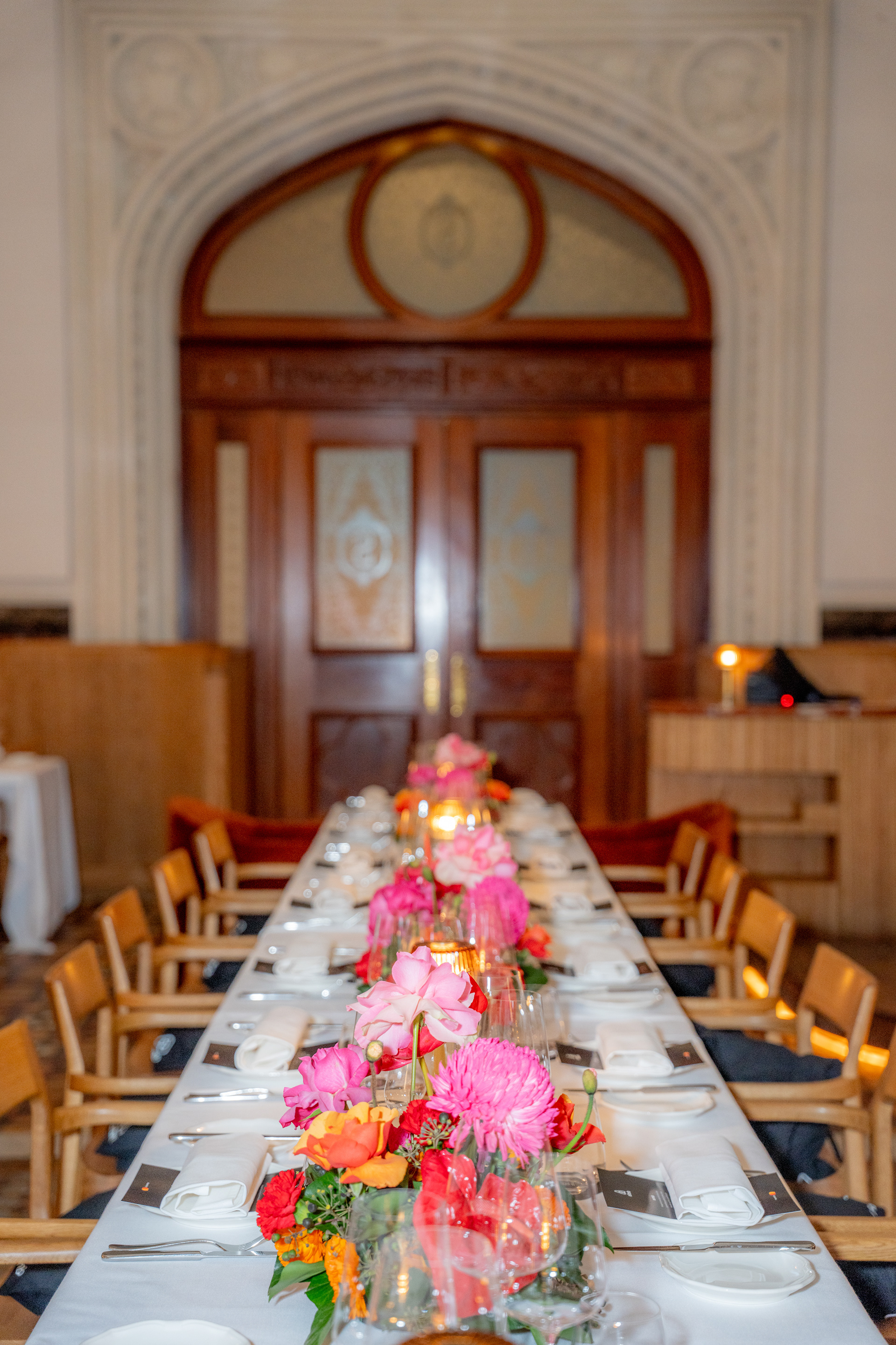 Long dining table with flowers in an elegant restaurant