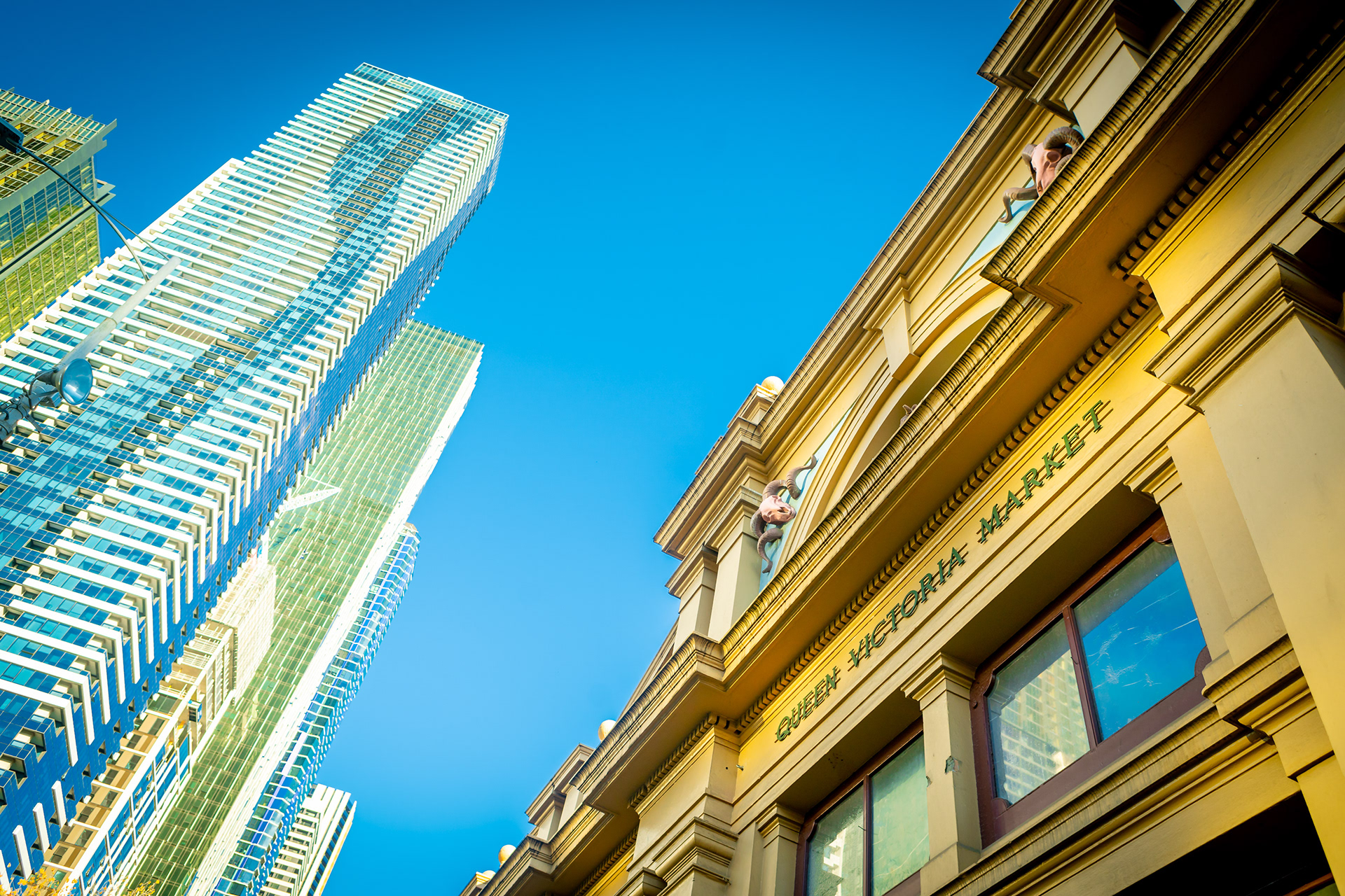 Queen Victoria Market facade beneath modern city towers
