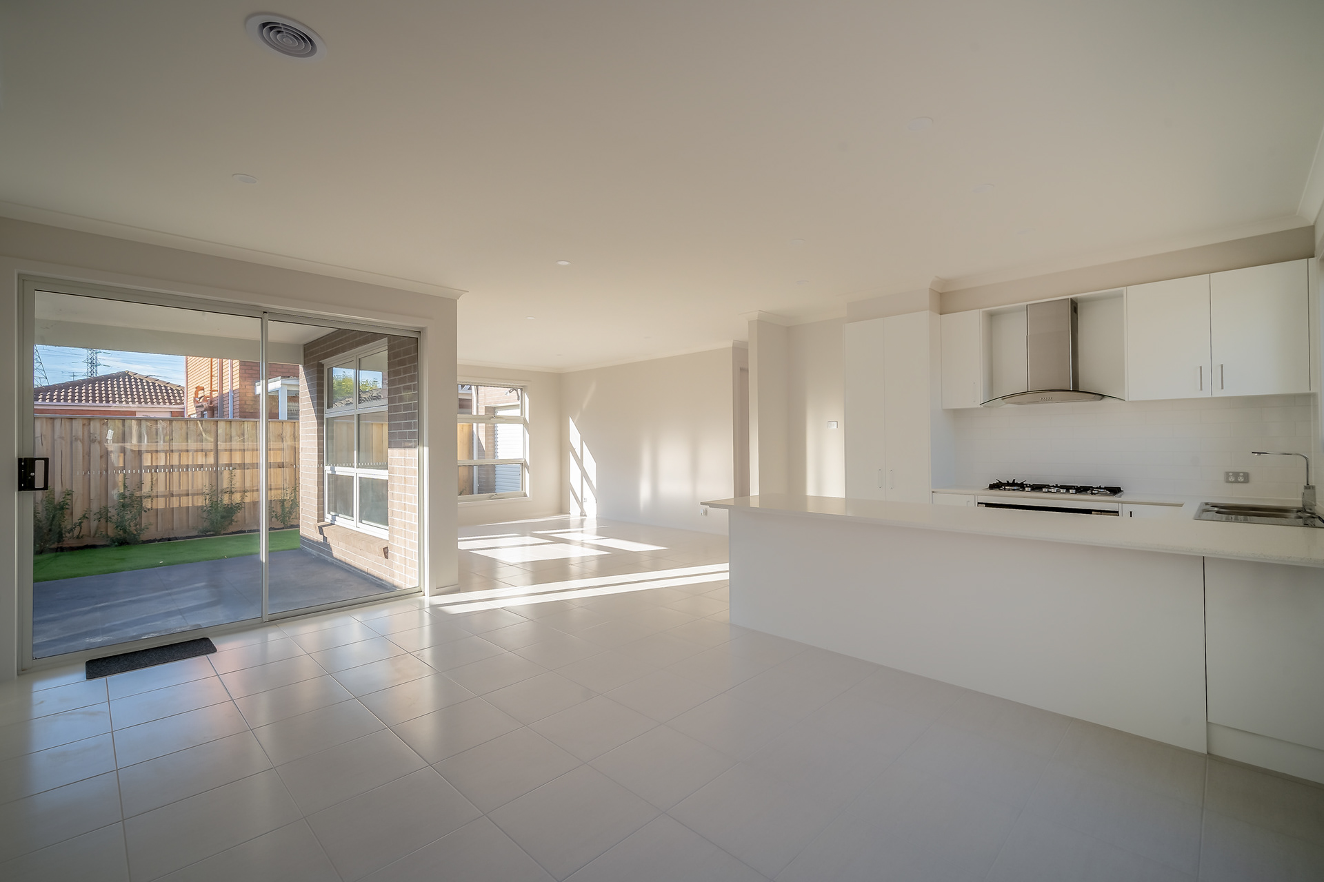 Open-plan kitchen and living area opening onto a garden