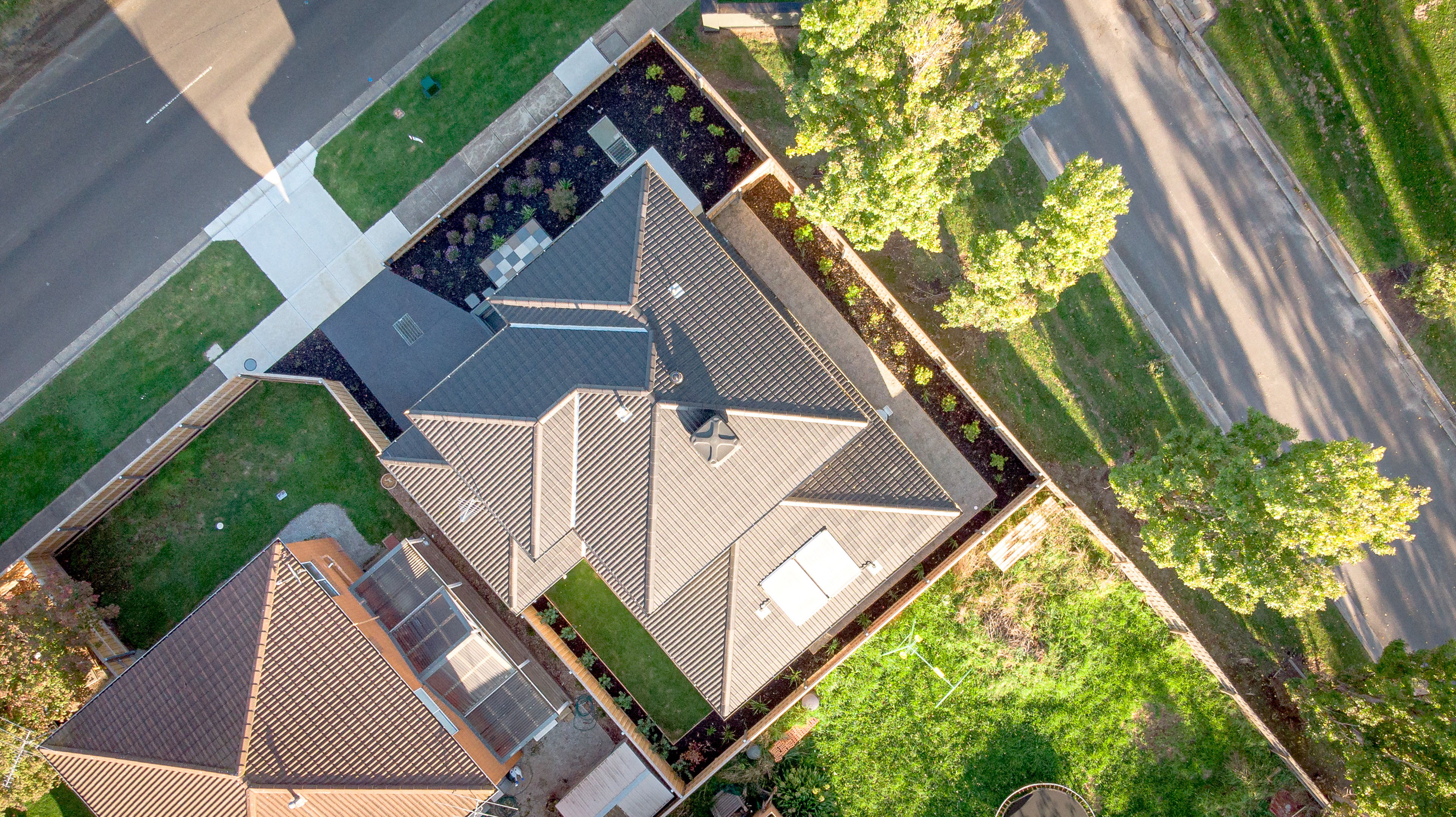 Aerial view of a house, garden and neighbouring street