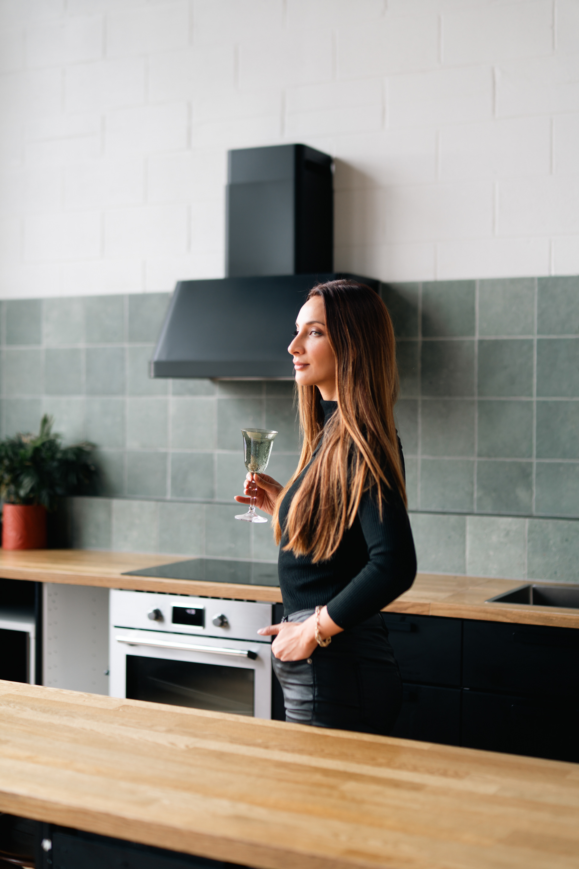 Portrait beside a kitchen counter in a loft studio