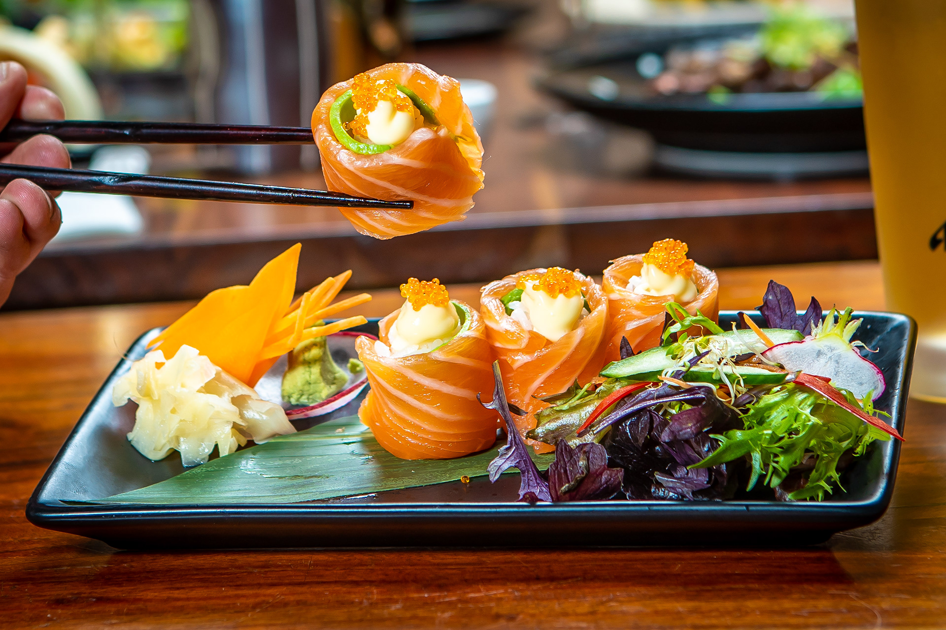 Wraps served with salad on a rectangular plate