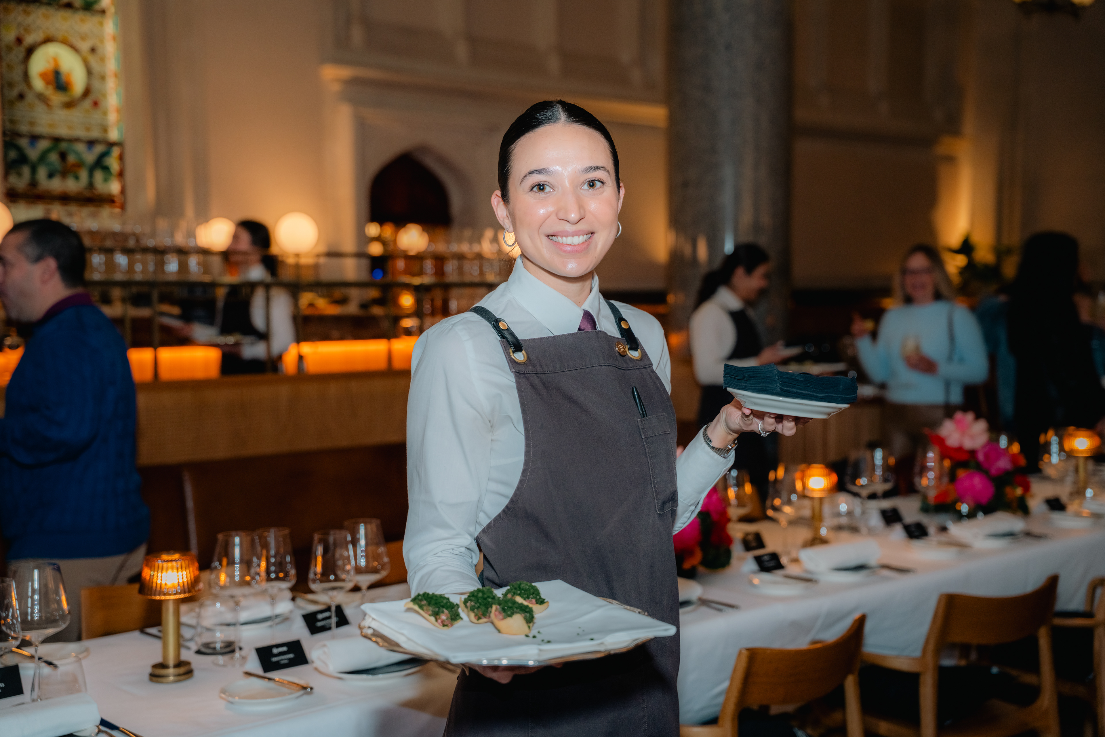 Guest seated with wine and food in a restaurant
