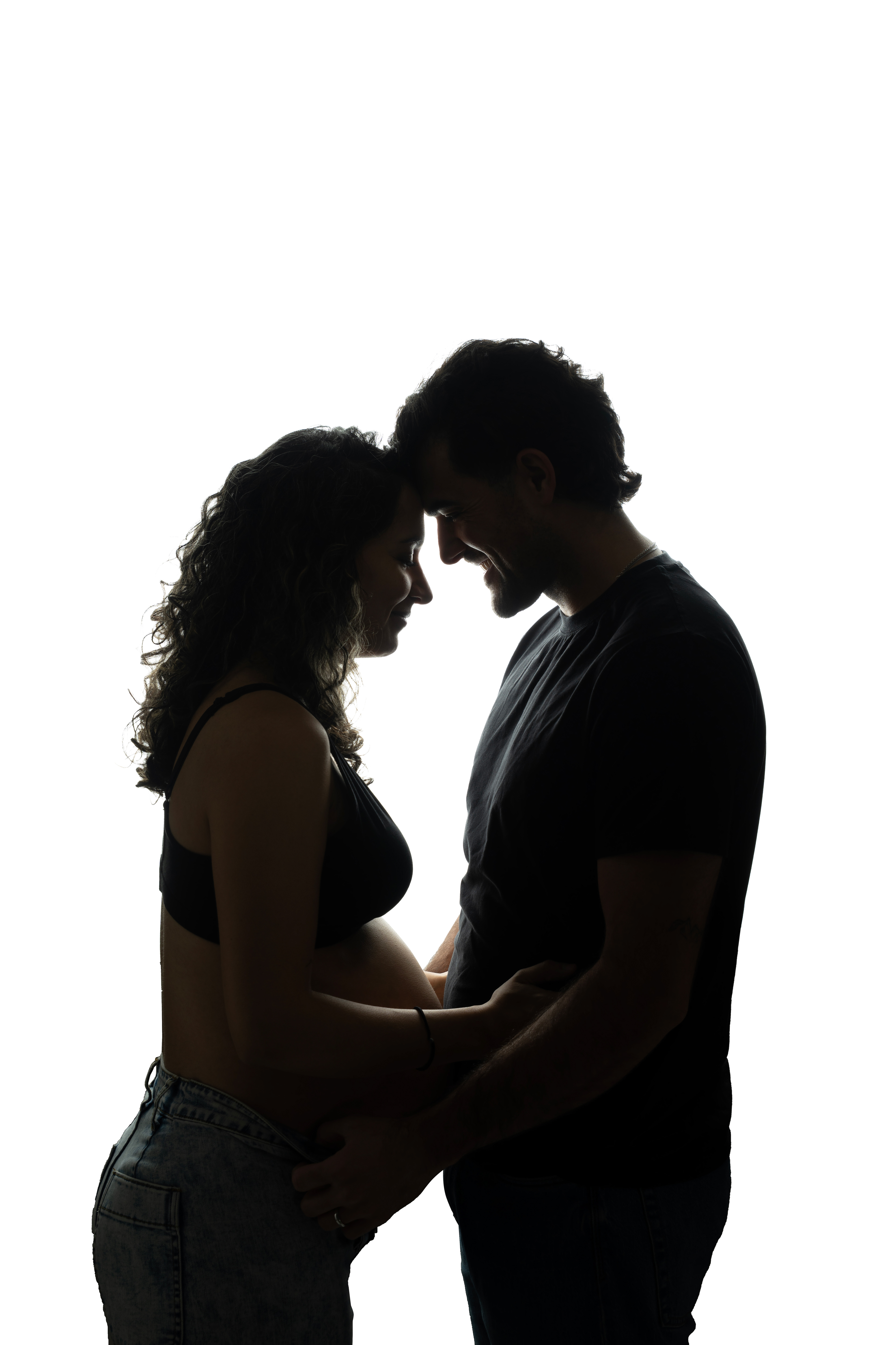 Silhouette of a couple leaning together