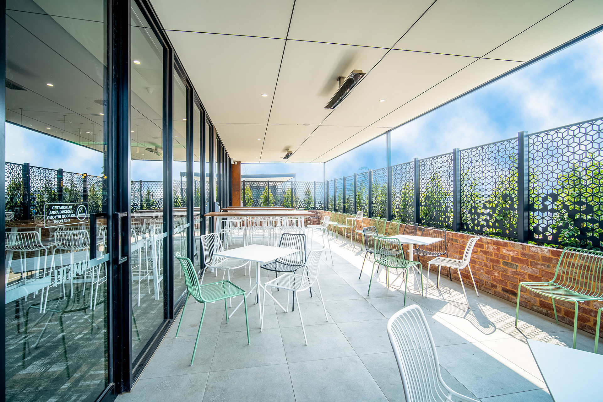Bright restaurant interior with floor-to-ceiling windows