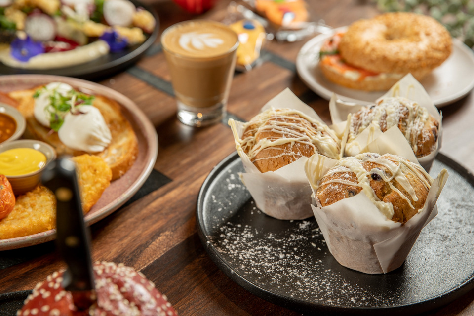 Coffee cups and brunch dishes on a cafe table