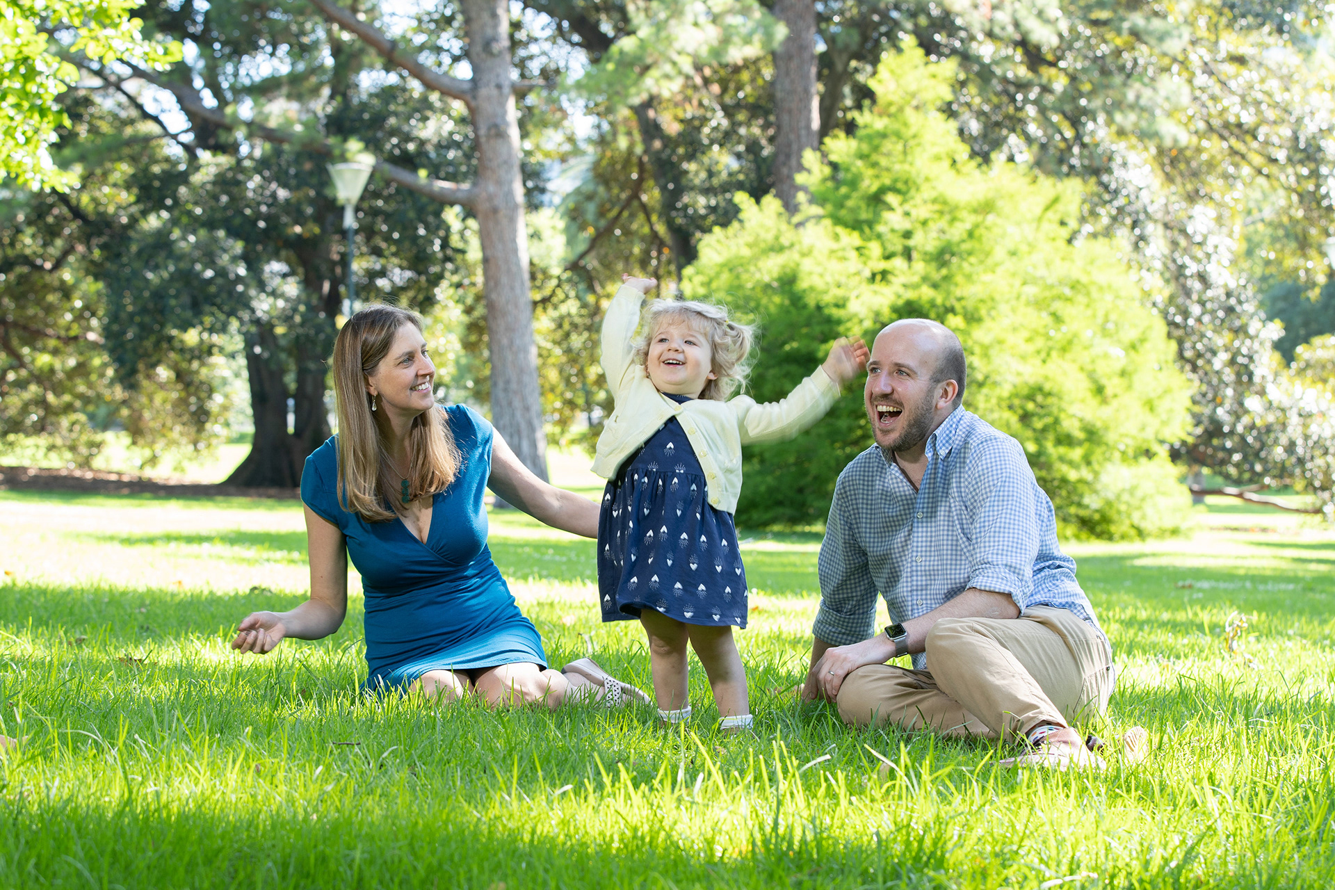 Family spending time together beside a stream