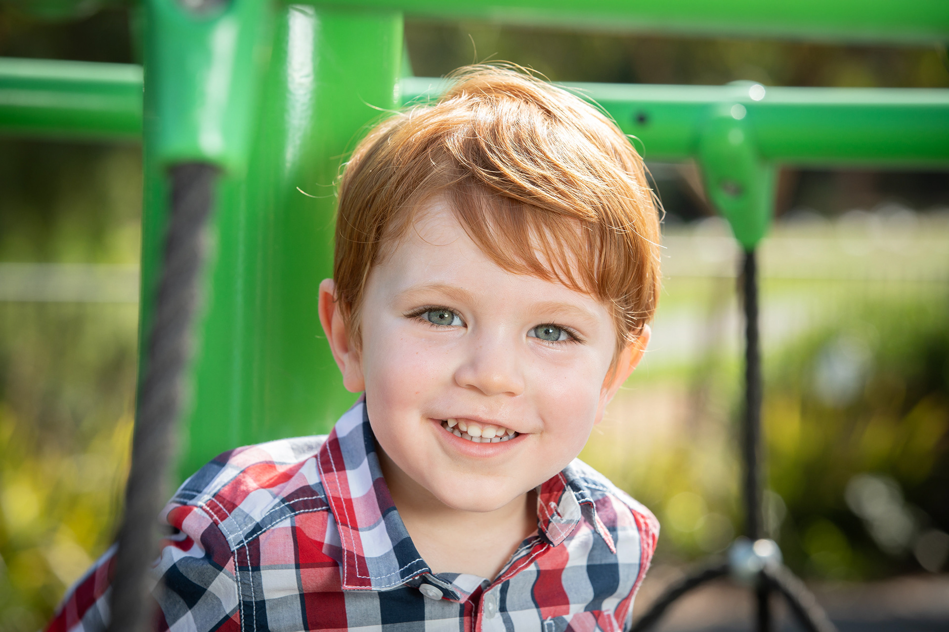 Child smiling in a playground
