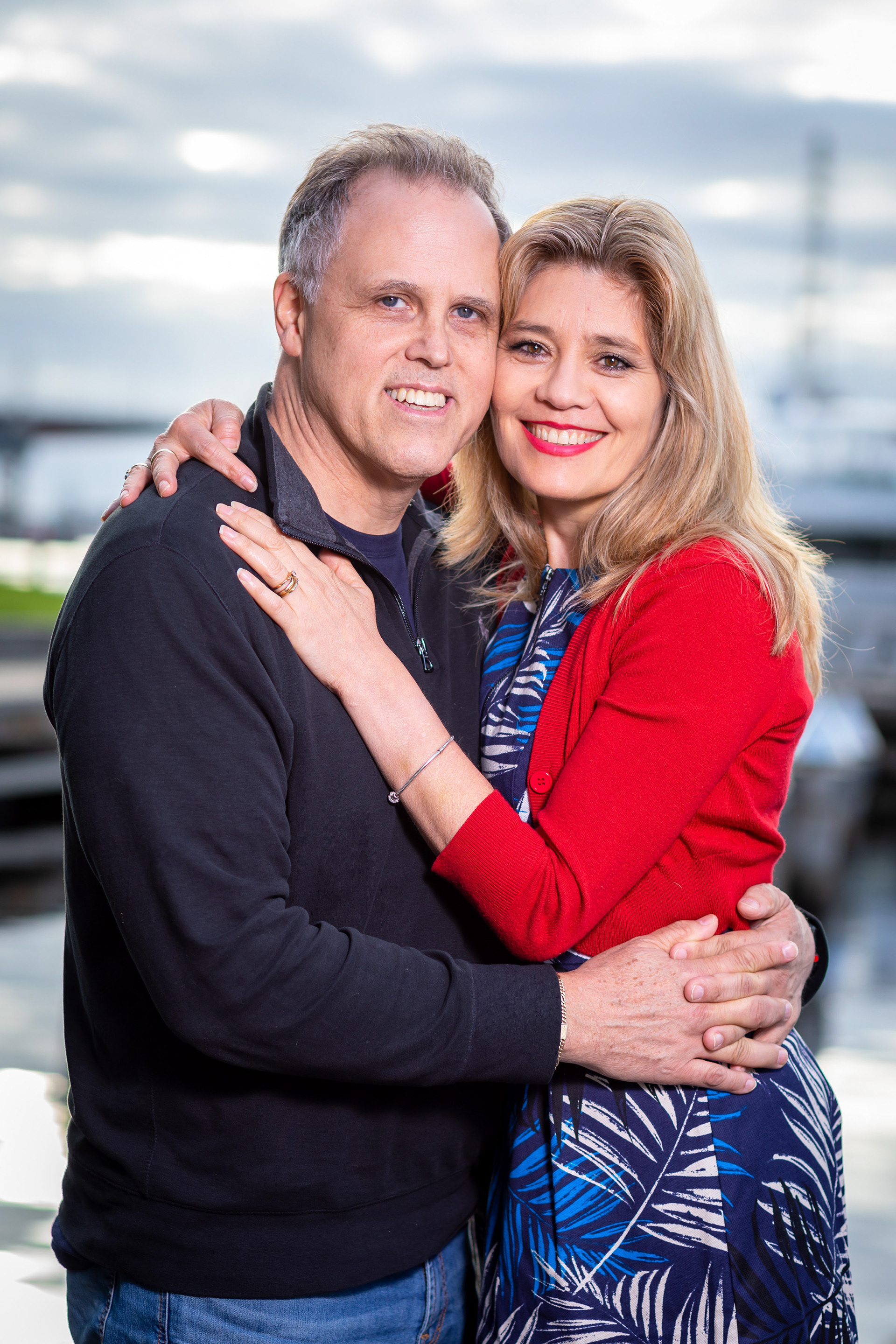 Couple embracing beside the waterfront
