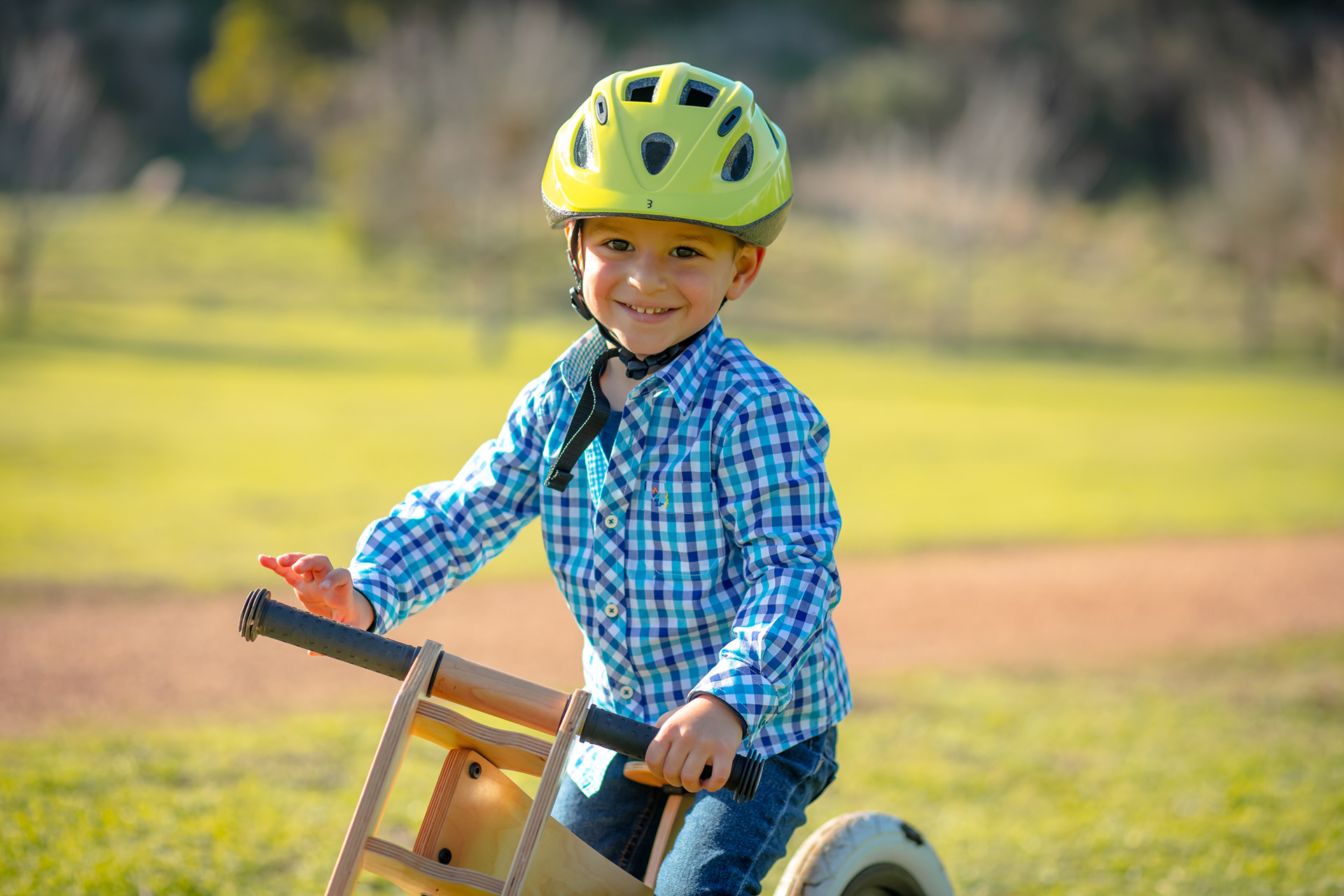 Child wearing a helmet while riding a bicycle