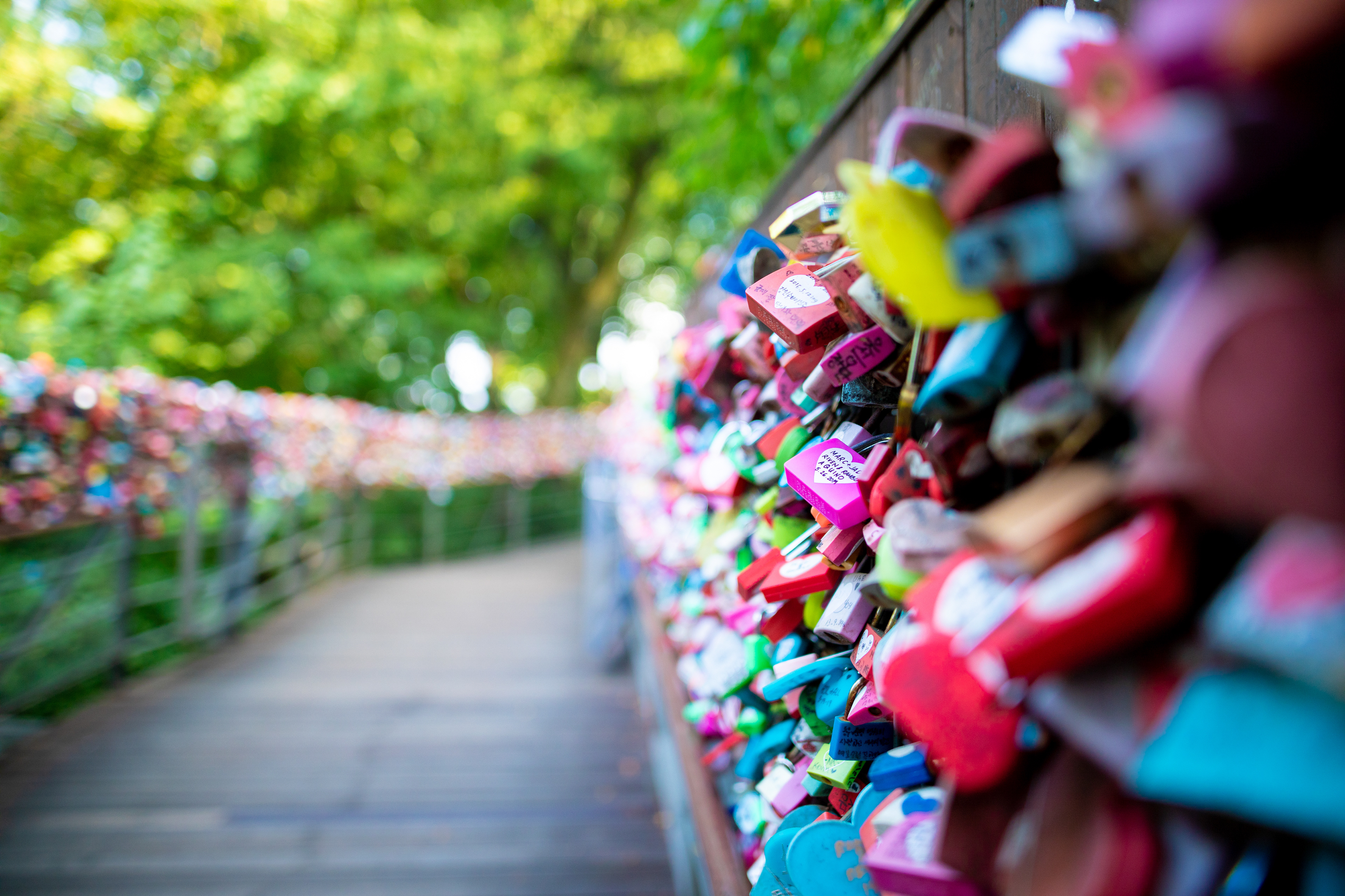 Colourful love locks attached to a railing