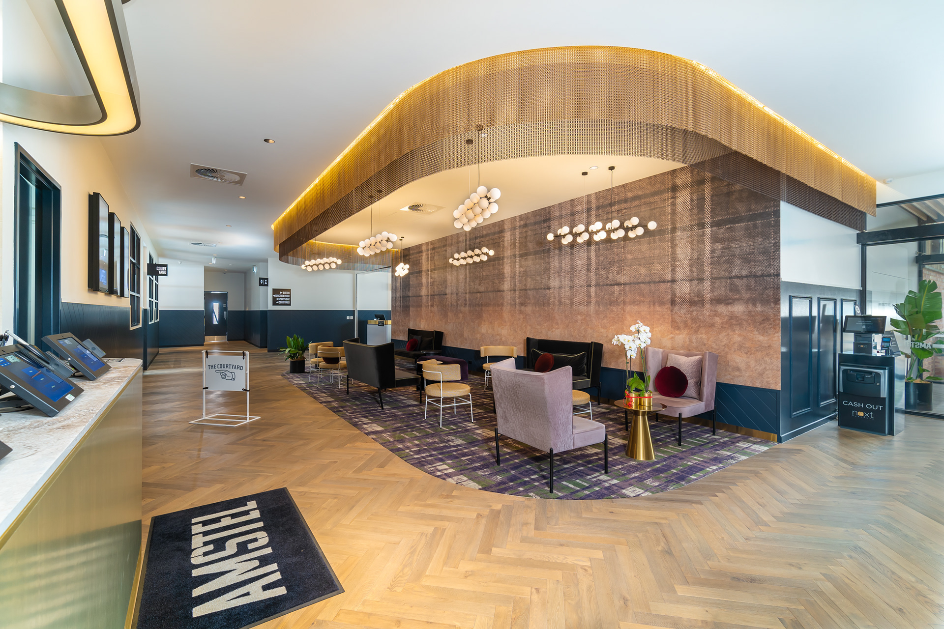 Restaurant counter beneath a curved timber ceiling