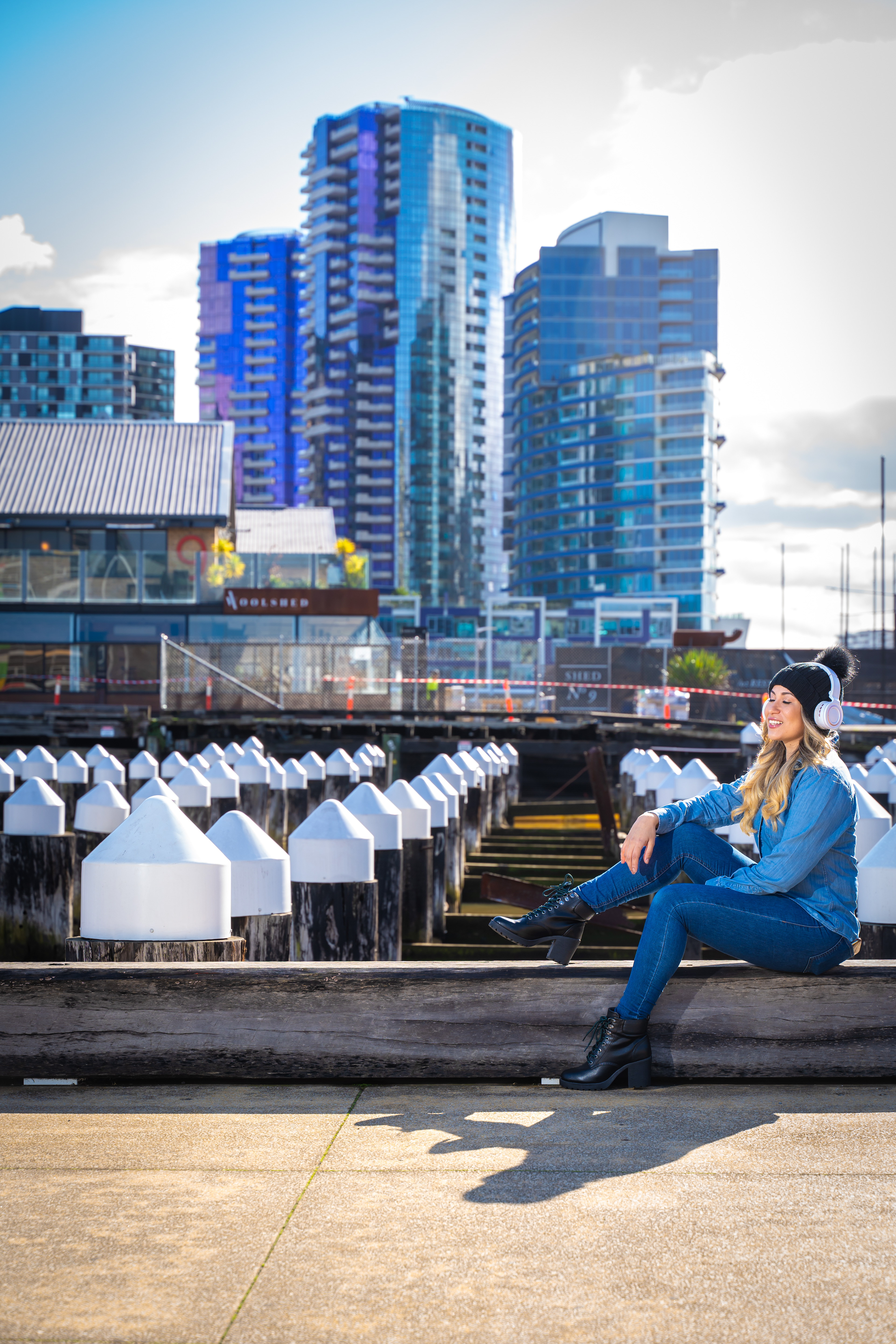 Outdoor portrait beside the waterfront with the Melbourne skyline in the background