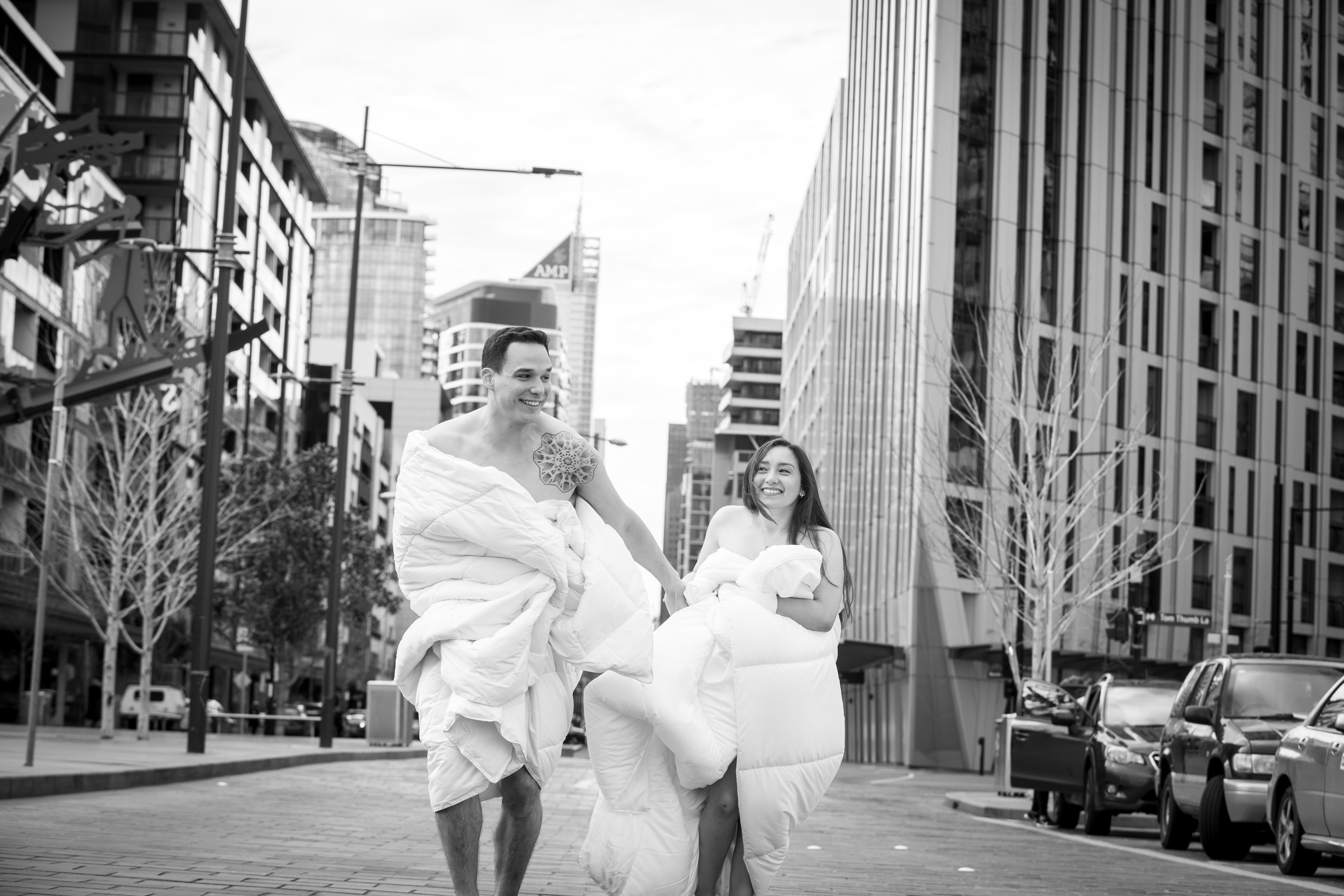 Black-and-white couple portrait on a city street