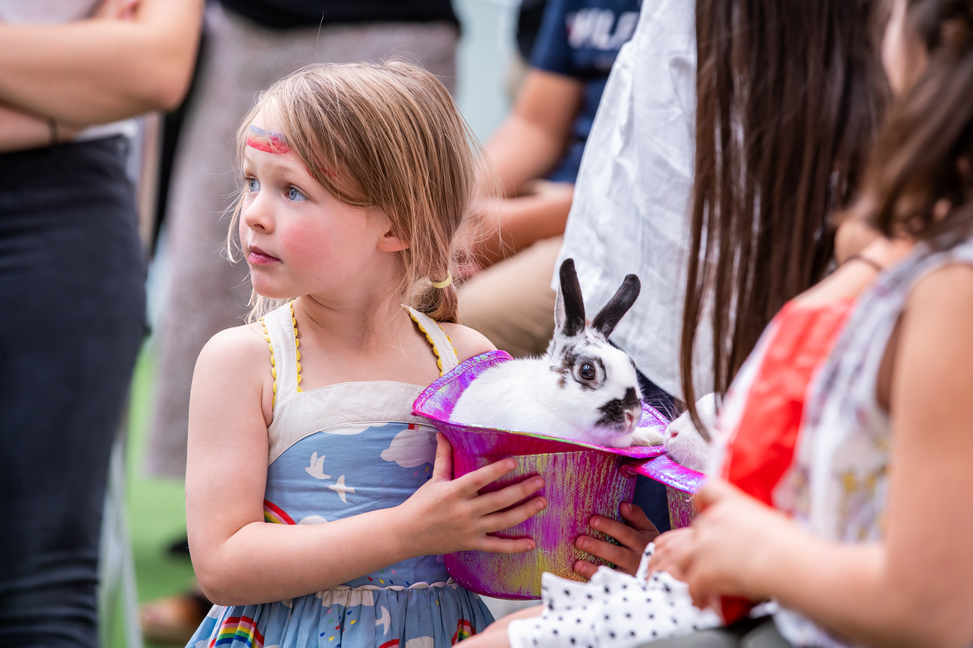Child watching an activity at a birthday party