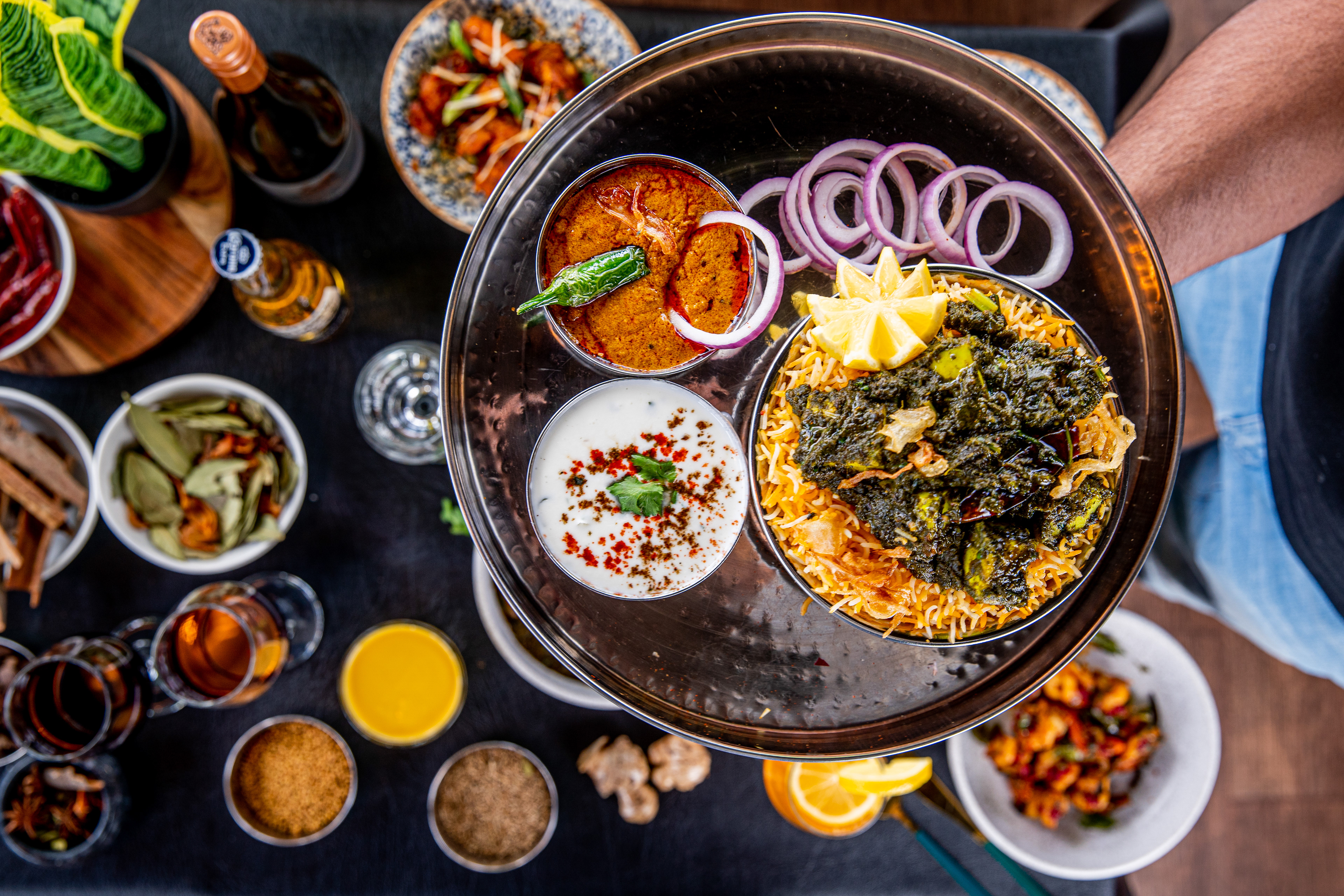 Noodle bowl with garnishes and small sauce dishes
