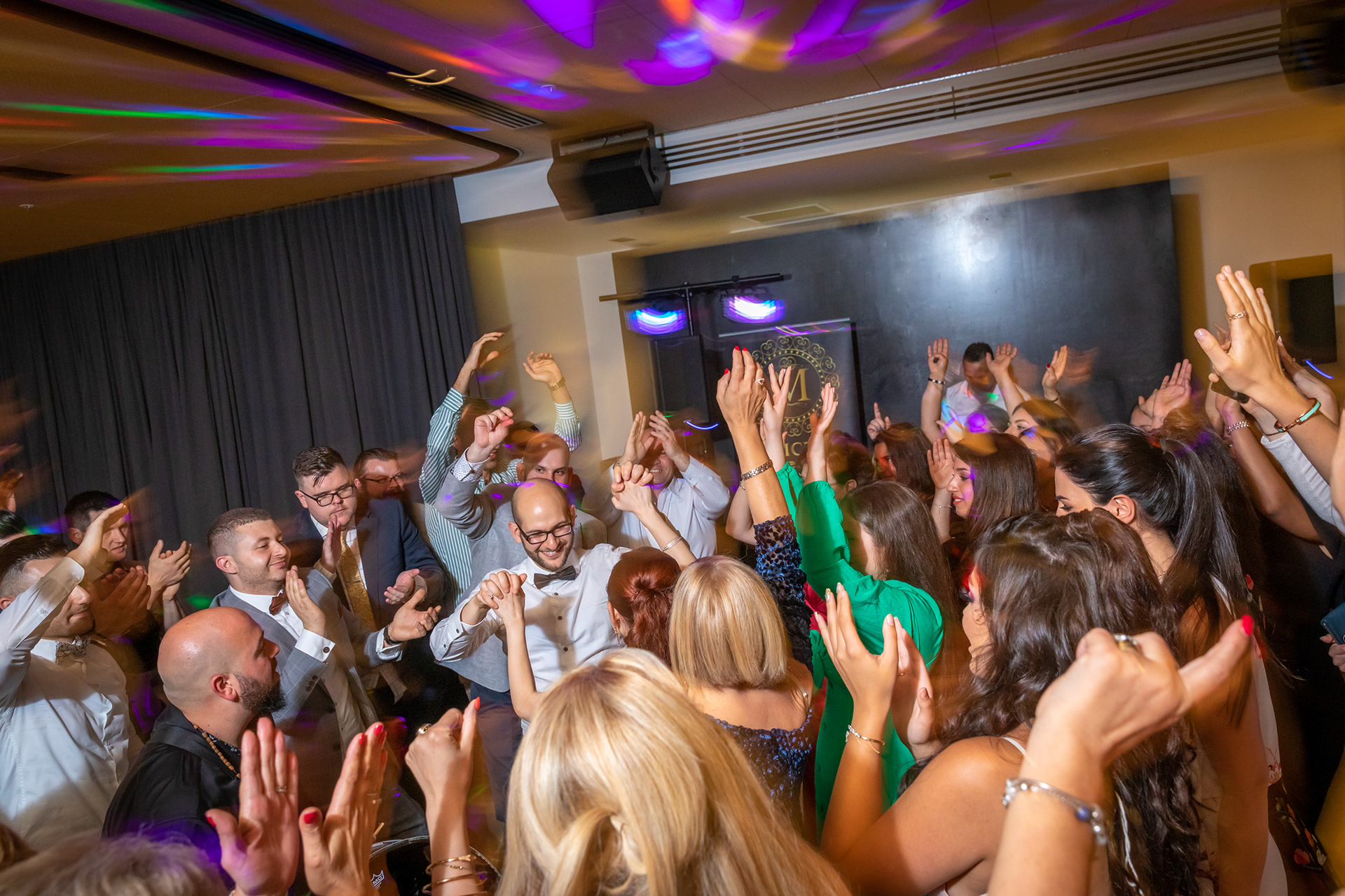Guests celebrating together on a crowded dance floor