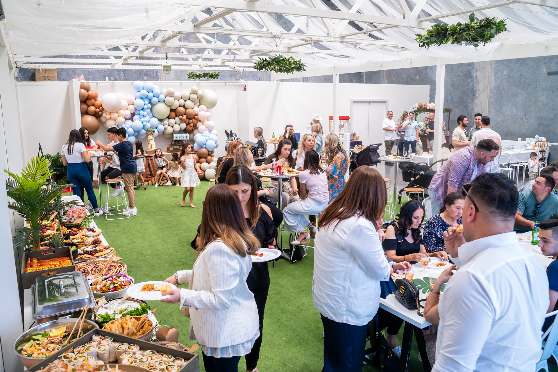 Wide view of guests at a garden party