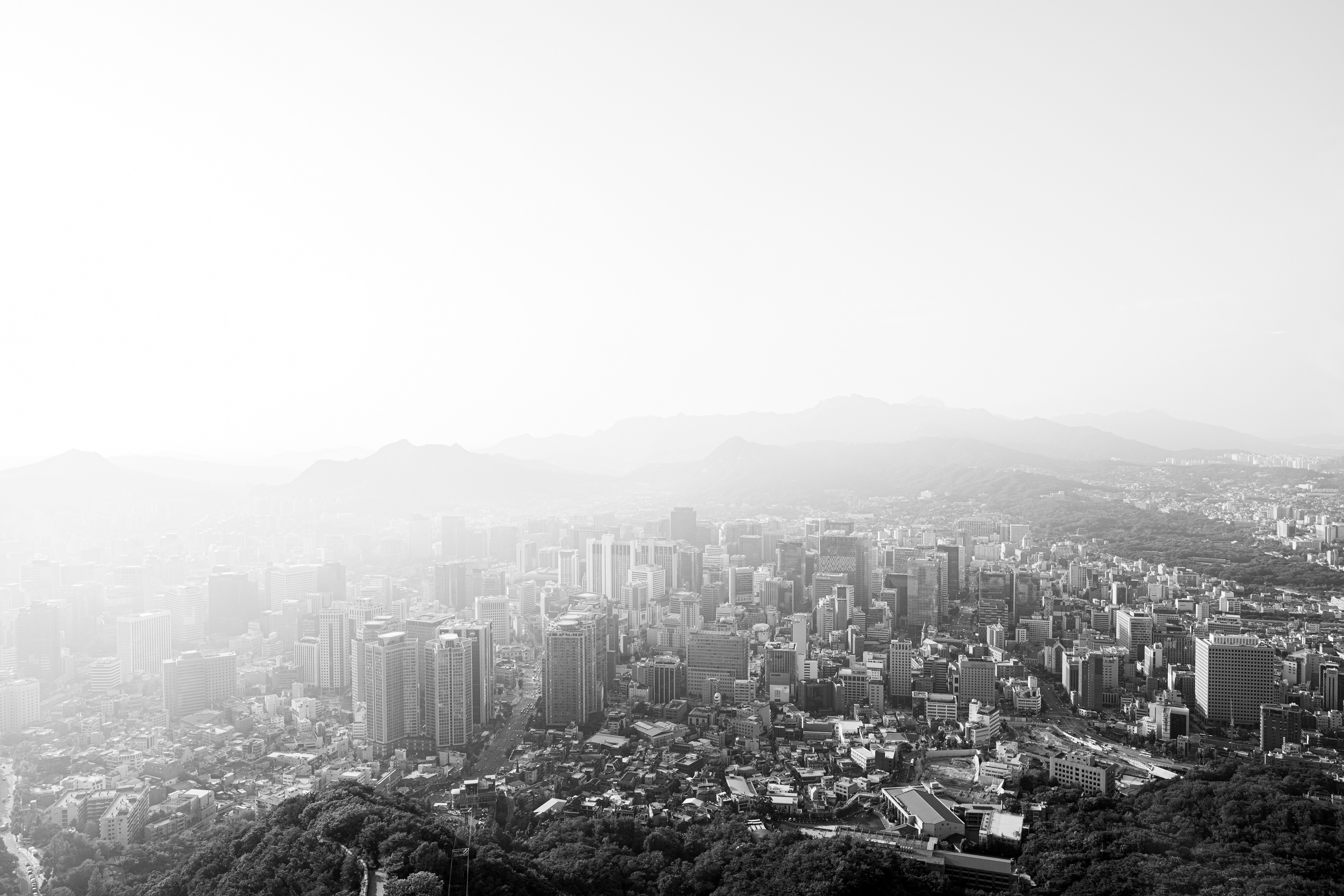 Black-and-white panoramic view across a city