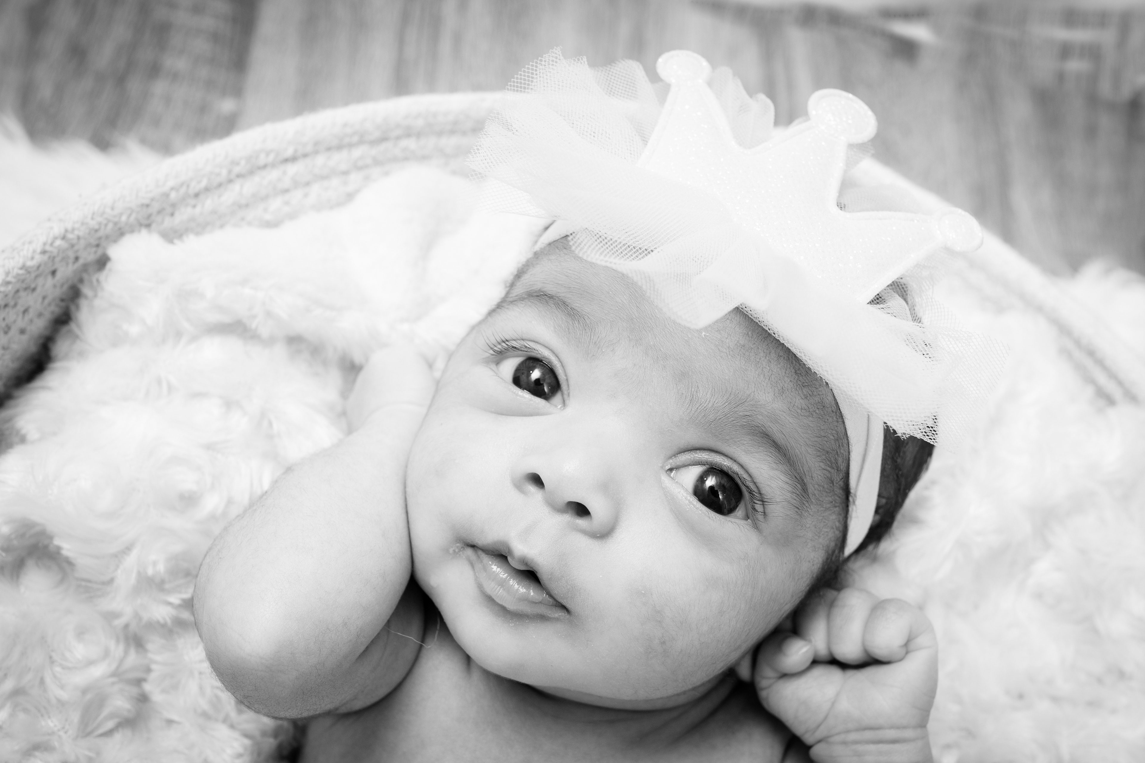 Black-and-white close-up portrait of a baby