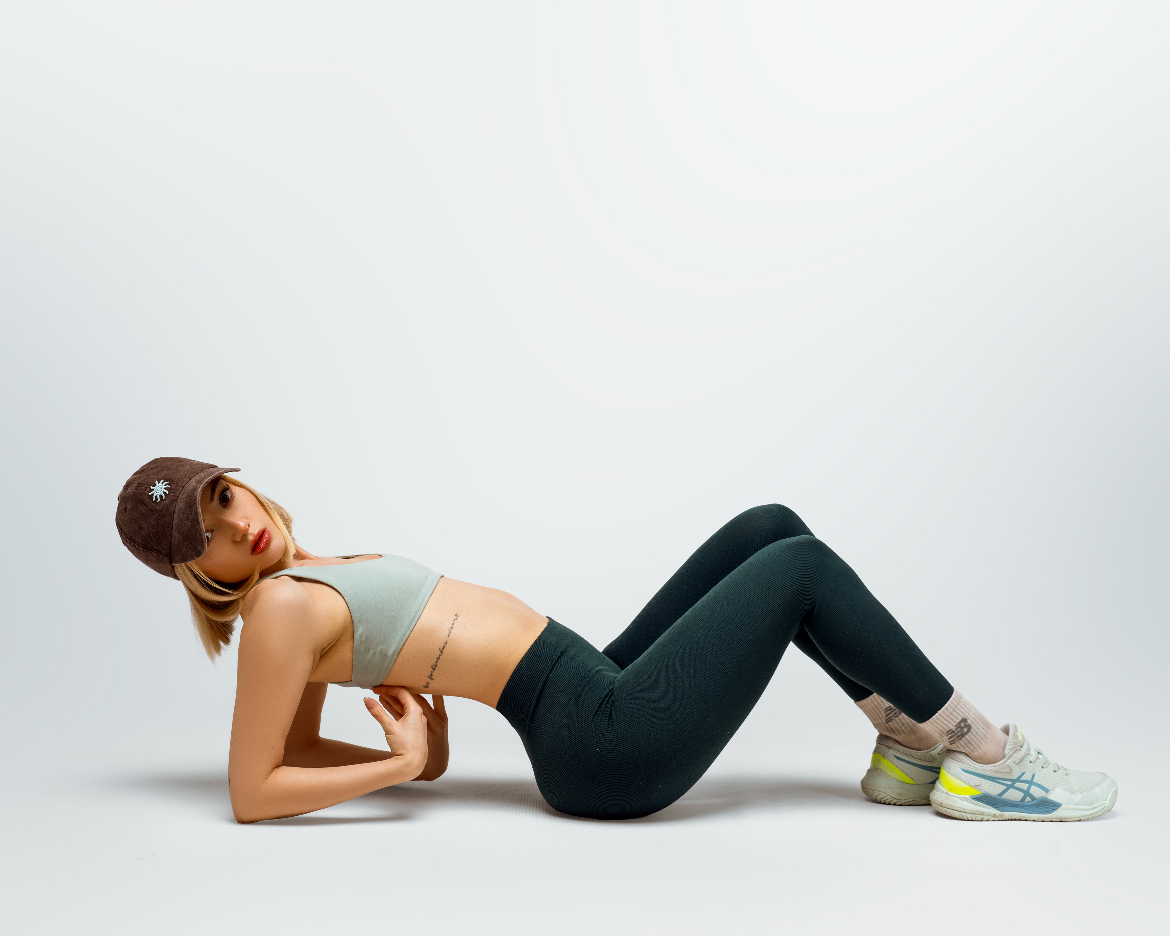 Fitness portrait reclining on the studio floor
