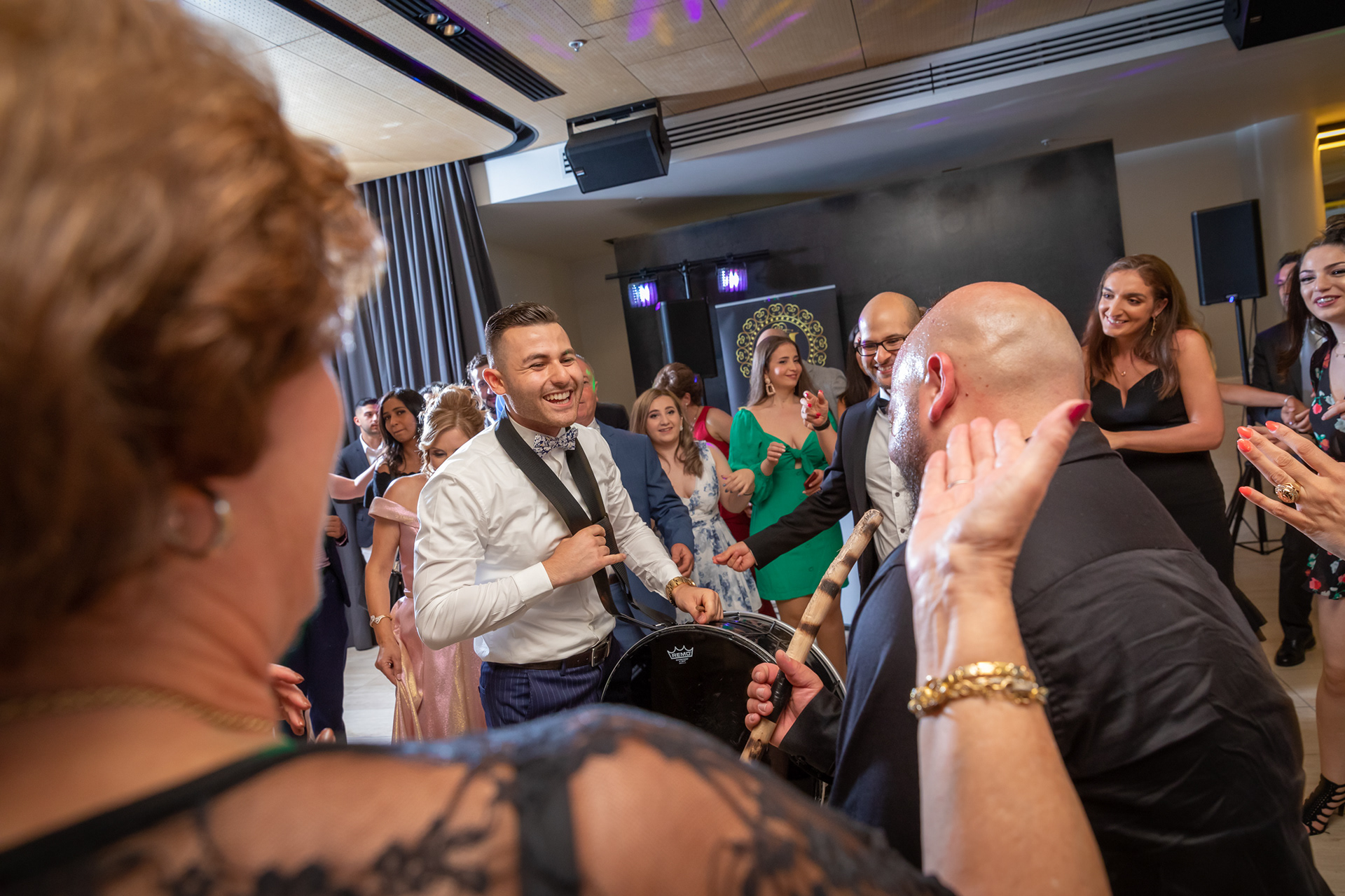 Candid moment among guests at an indoor celebration