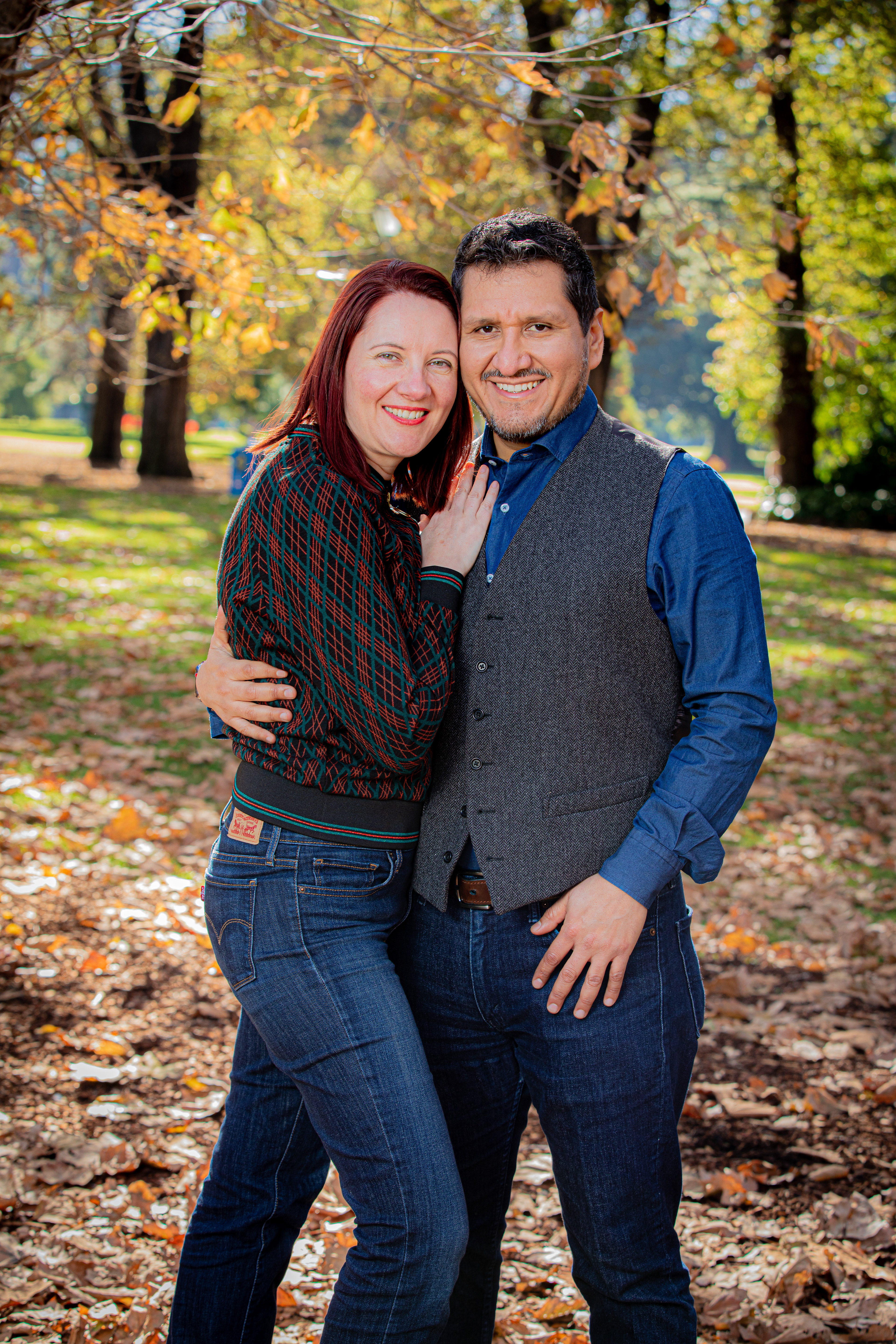 Playful portrait of a couple in an autumn park