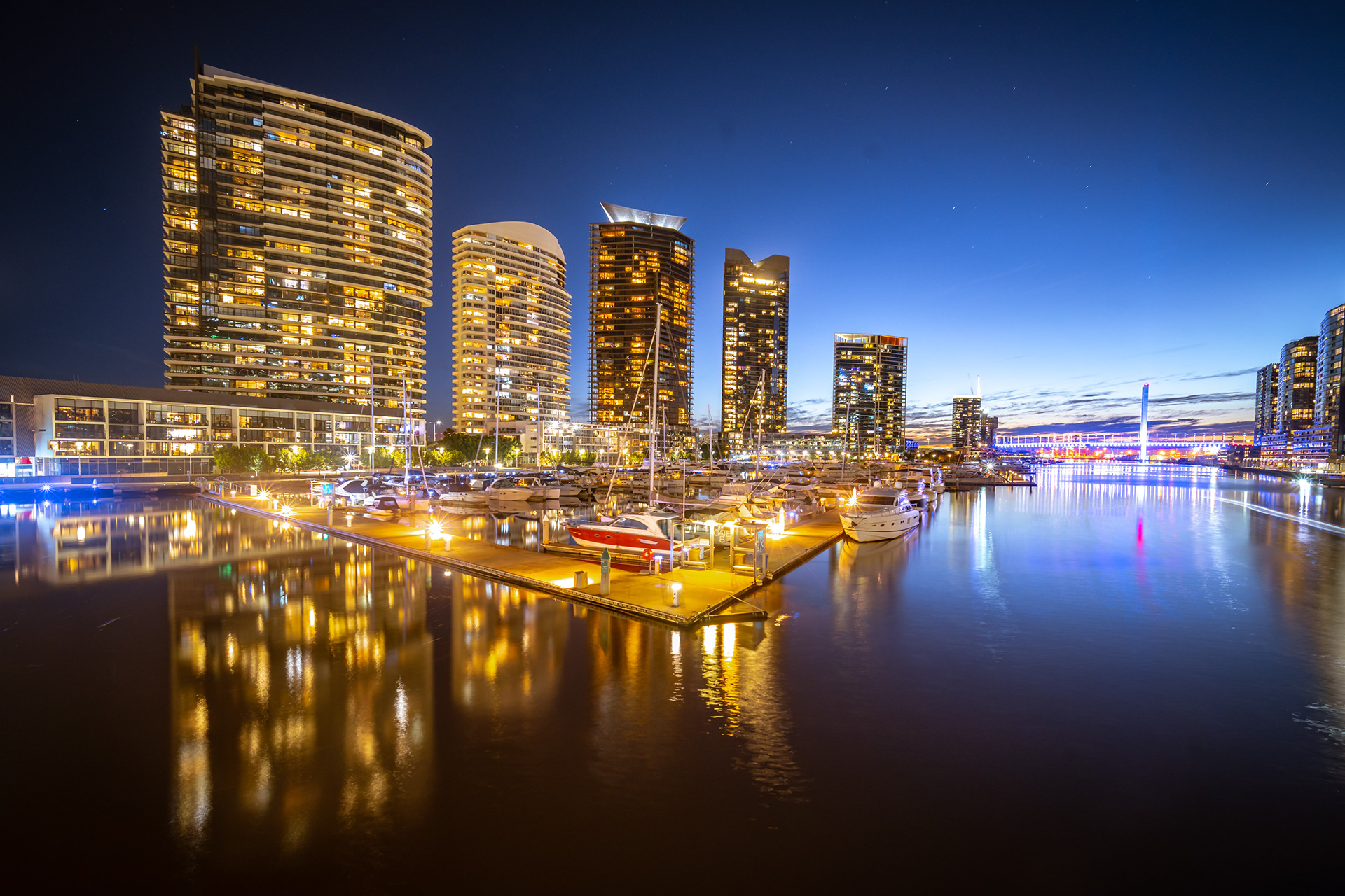 Waterfront apartments reflected in the water at night