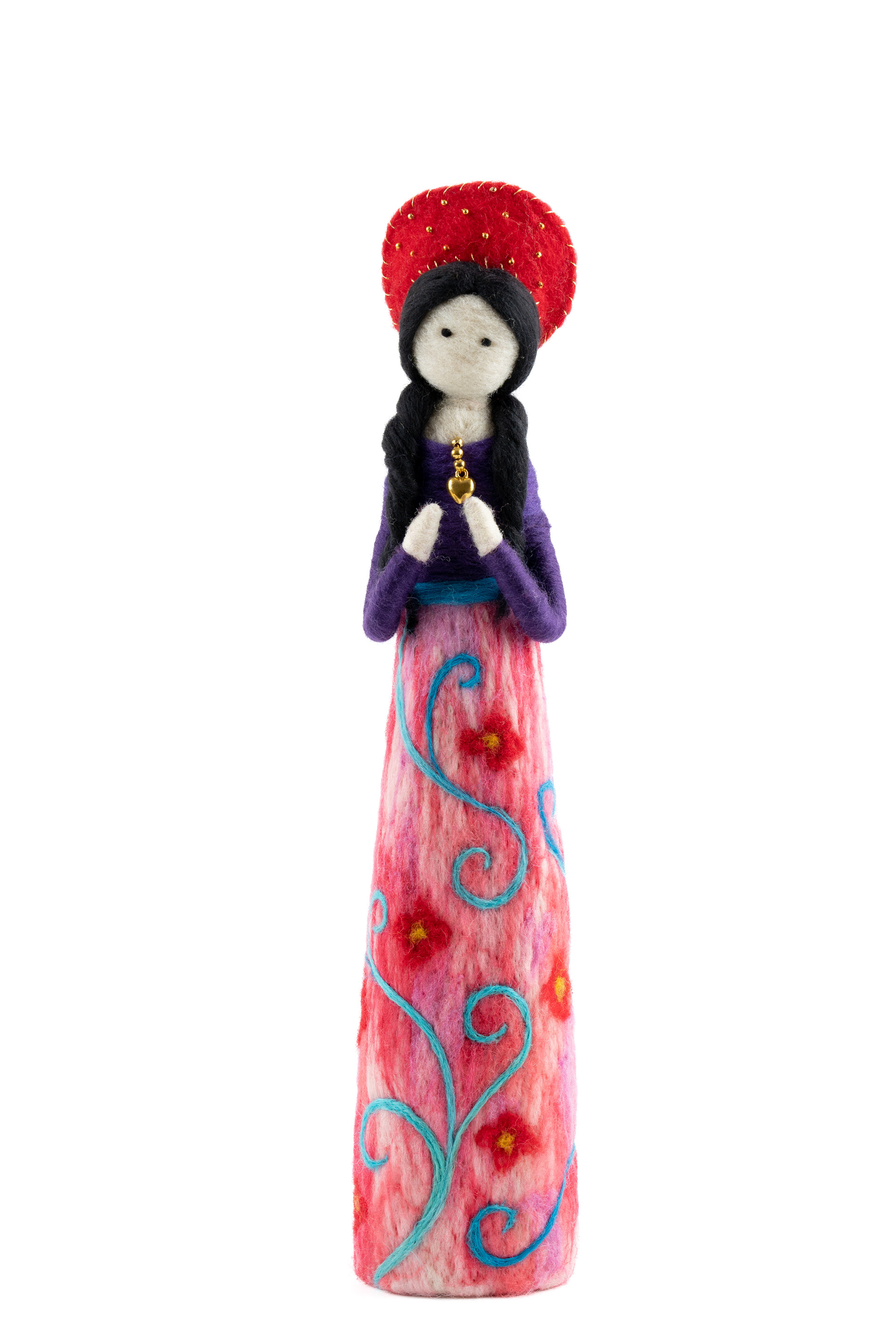 Decorative doll wearing a red hat and patterned skirt