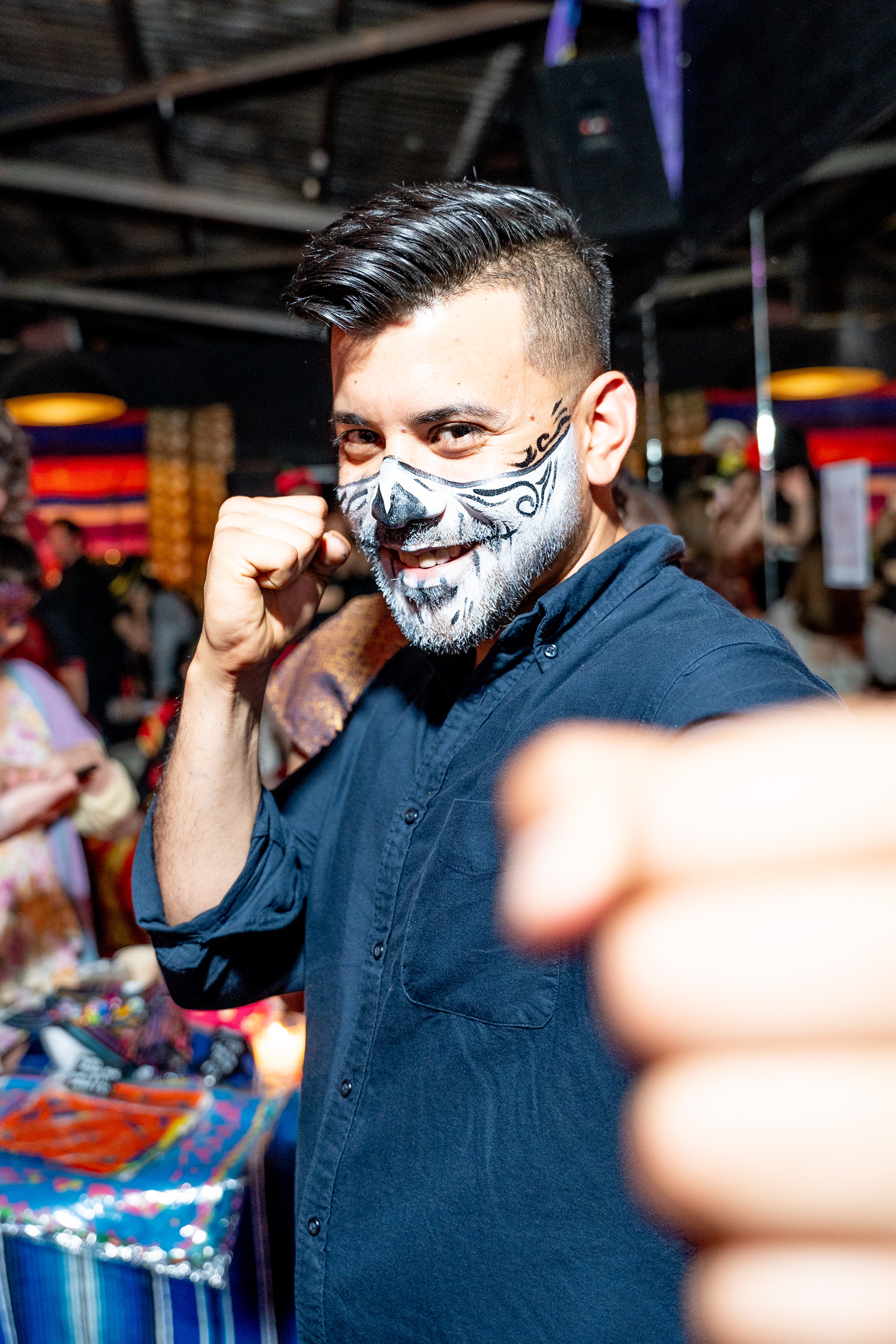 Guest wearing skull face paint at a celebration