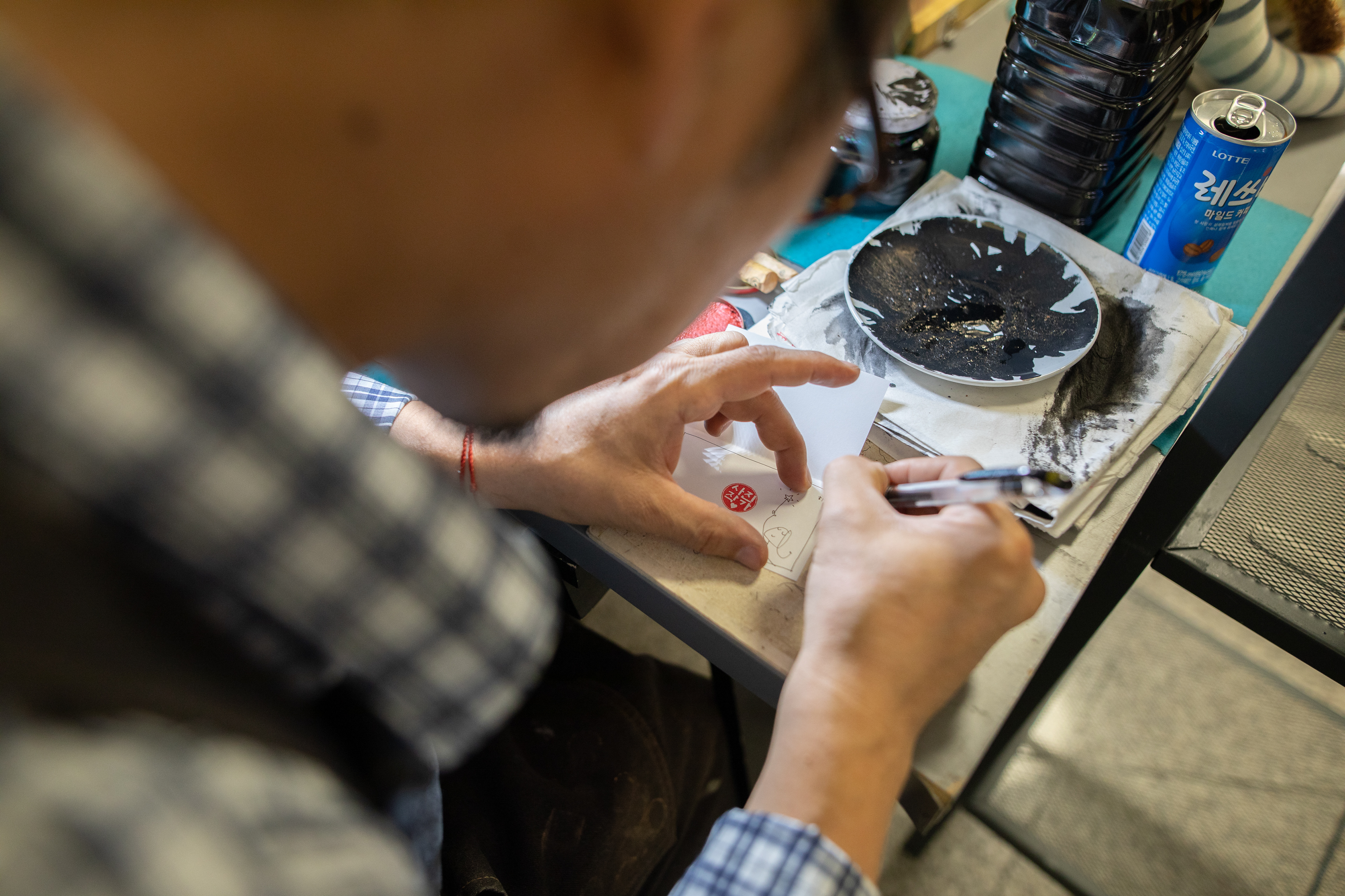 Artisan working with tools at a small workbench
