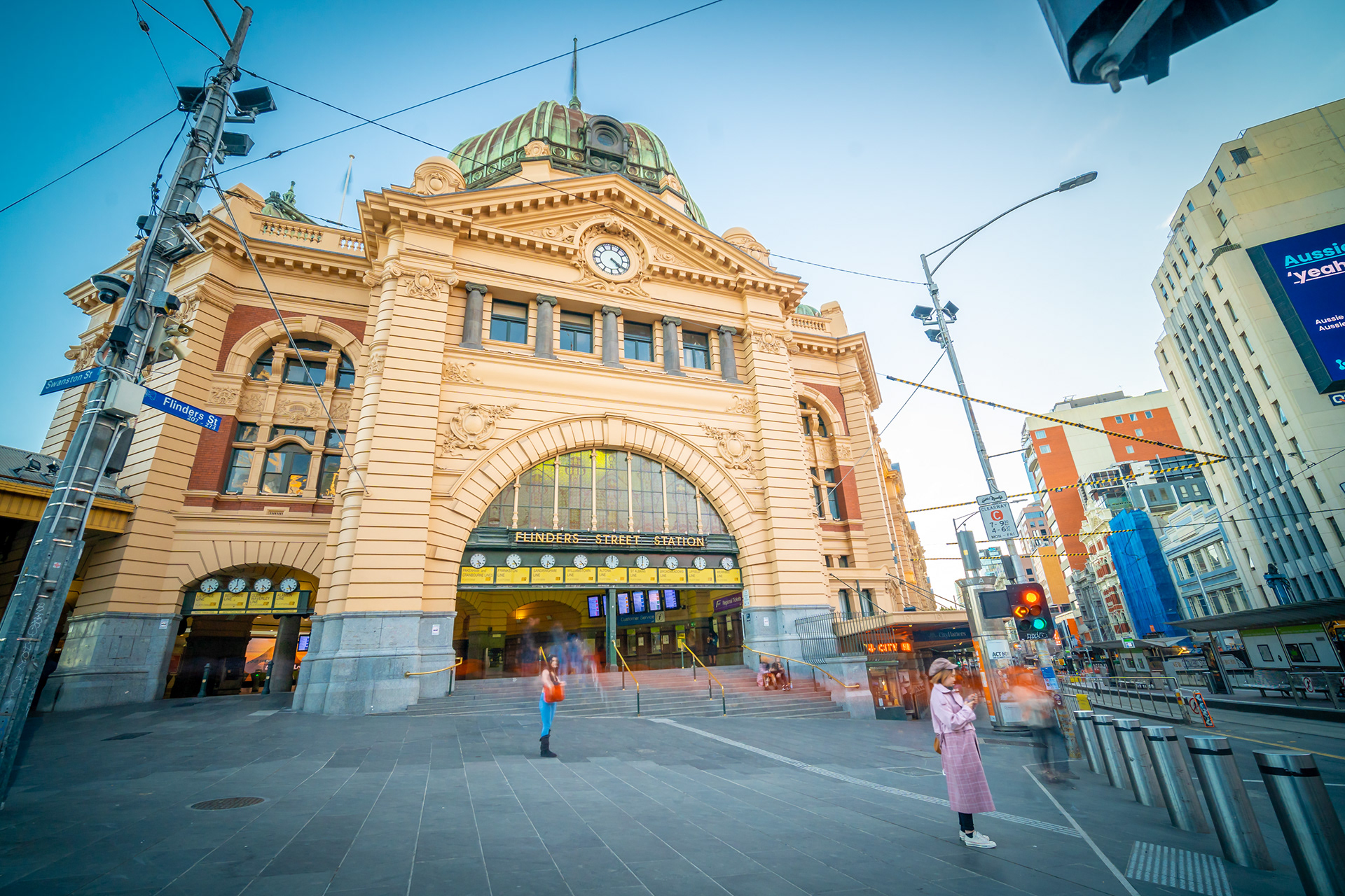 Flinders Street Station entrance under a blue sky