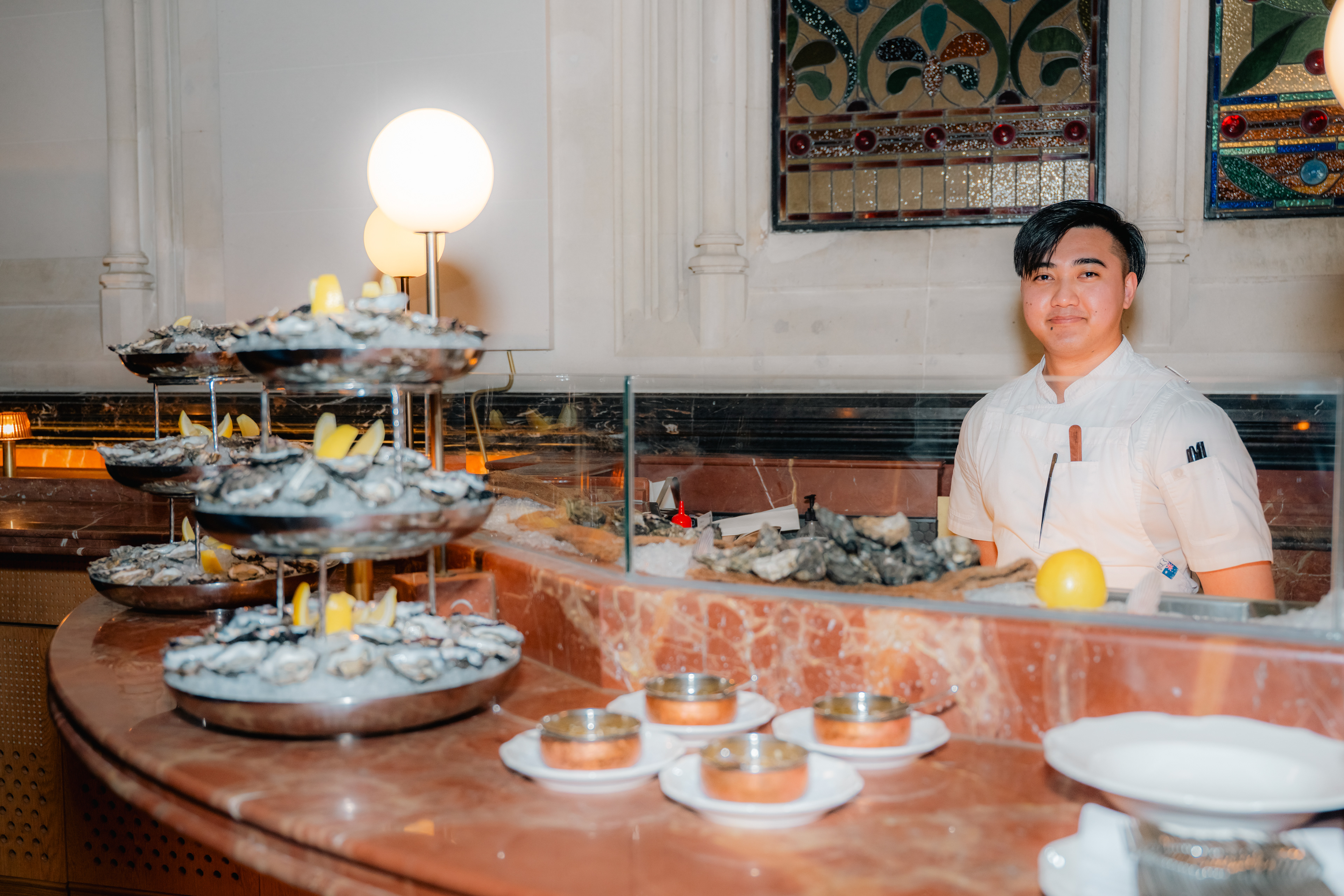 Guest enjoying food and wine at a restaurant table