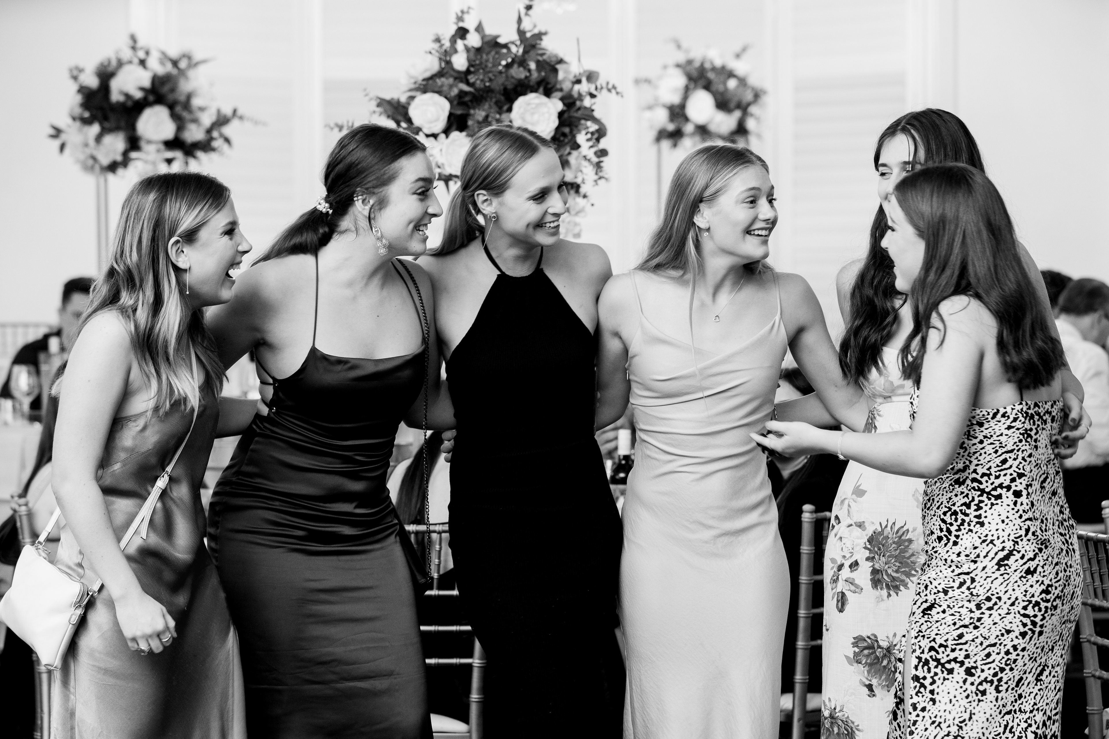 Black-and-white group portrait of guests at a celebration