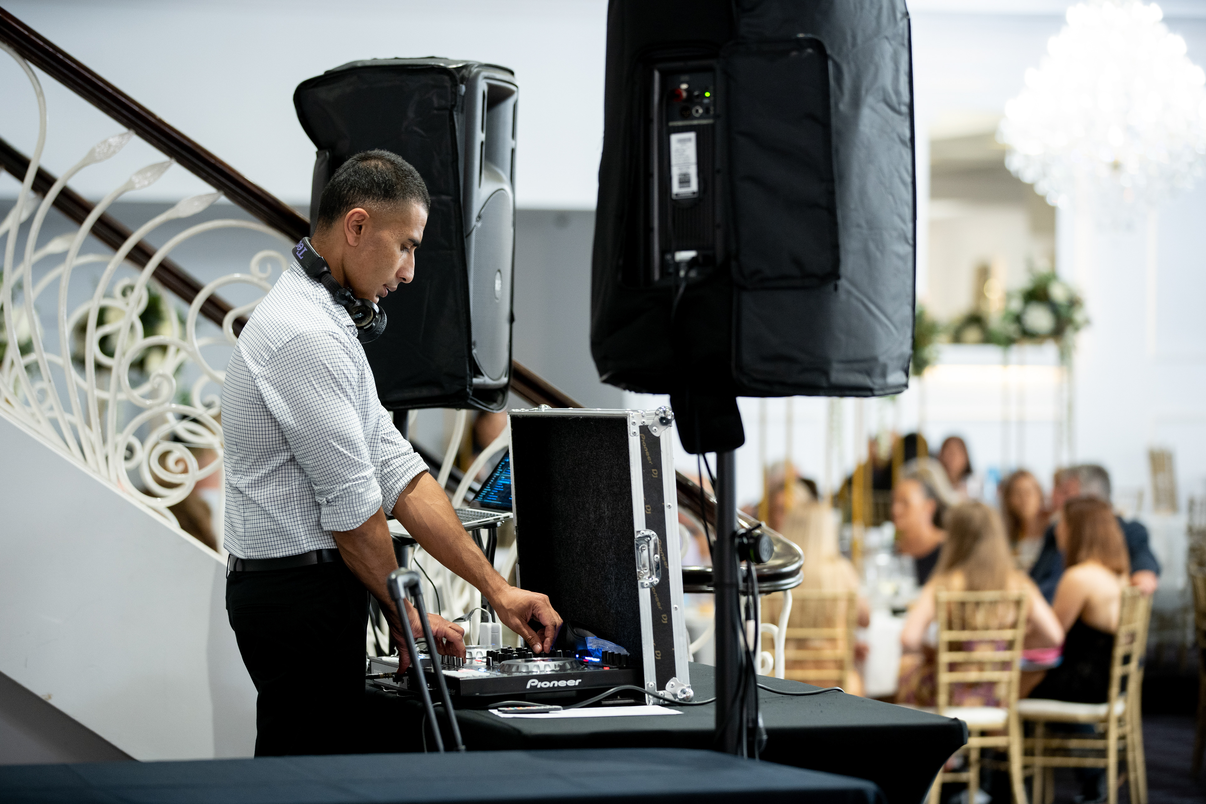 DJ working at a sound desk during an event