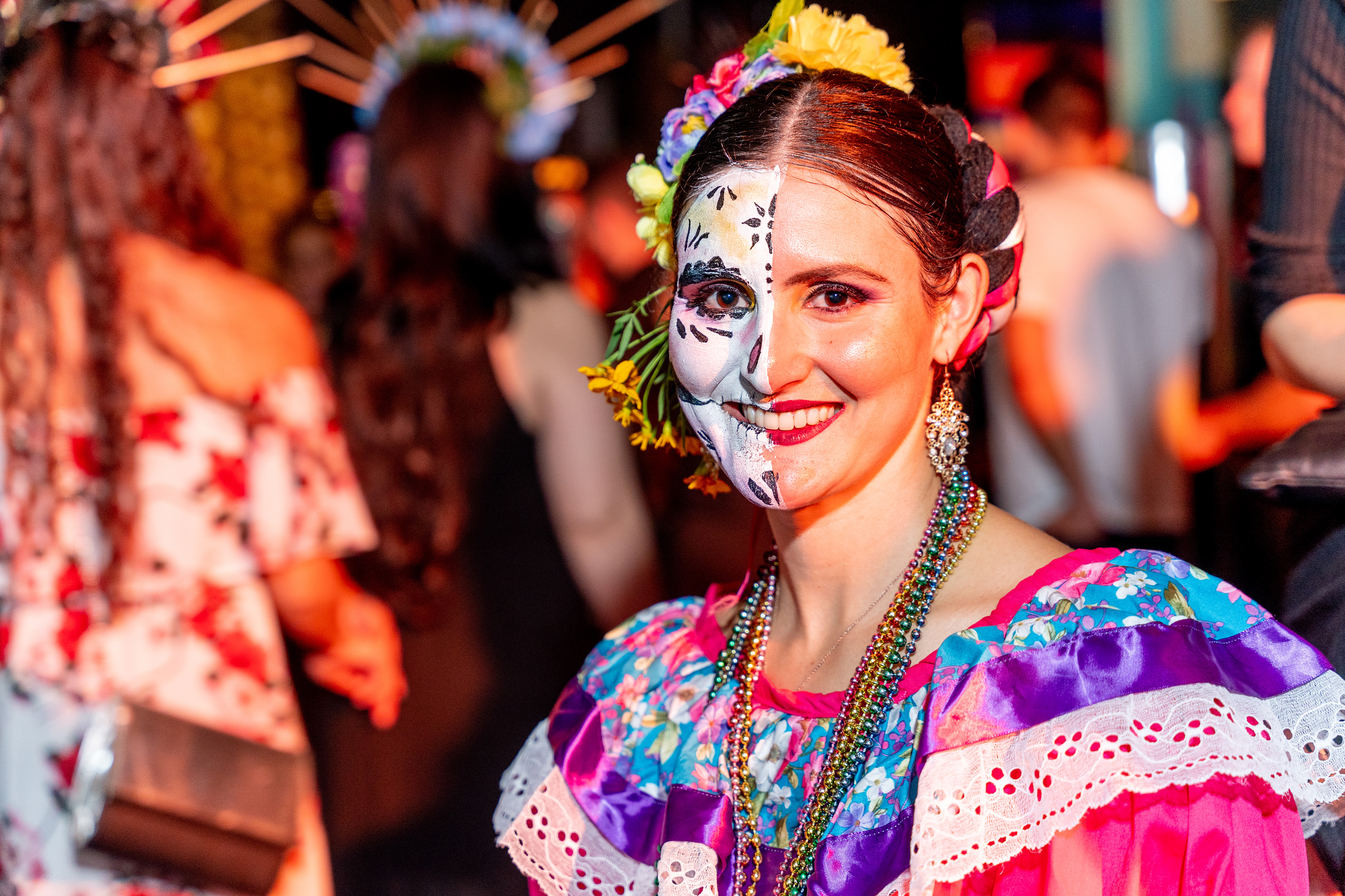Close-up portrait of a smiling dancer in a colourful costume