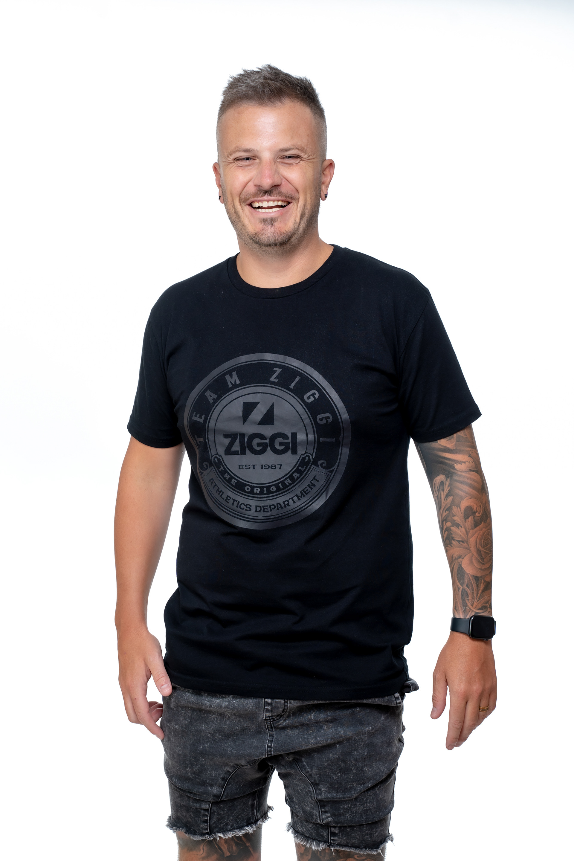 Studio portrait in a black branded T-shirt